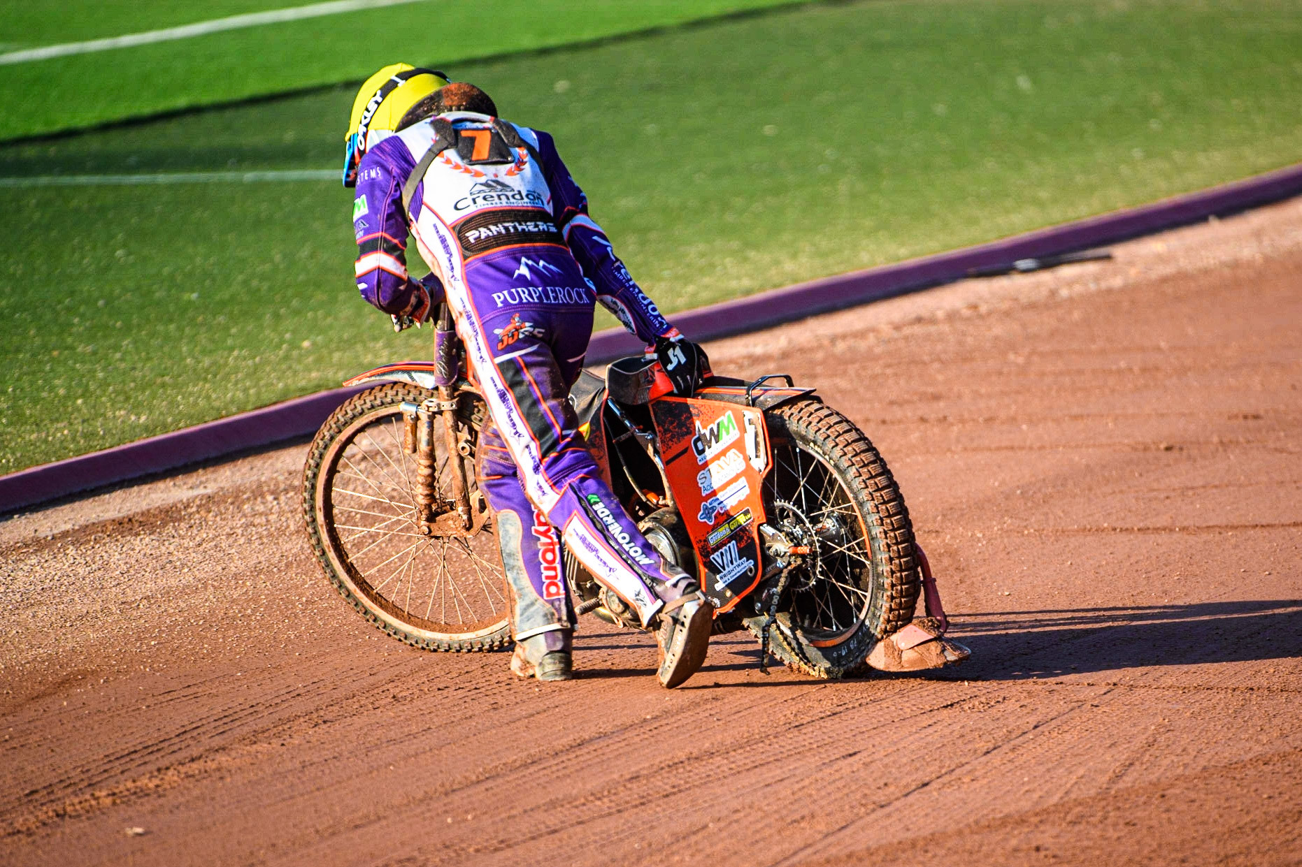 Jordan Jenkins pulls his bike from the track after shedding his chain and jamming the back wheel during the Sports Insure Premiership match between Belle Vue Aces and Peterborough at the National Speedway Stadium, Manchester on Monday 19th June 2023. (Photo: Ian Charles | MI News)