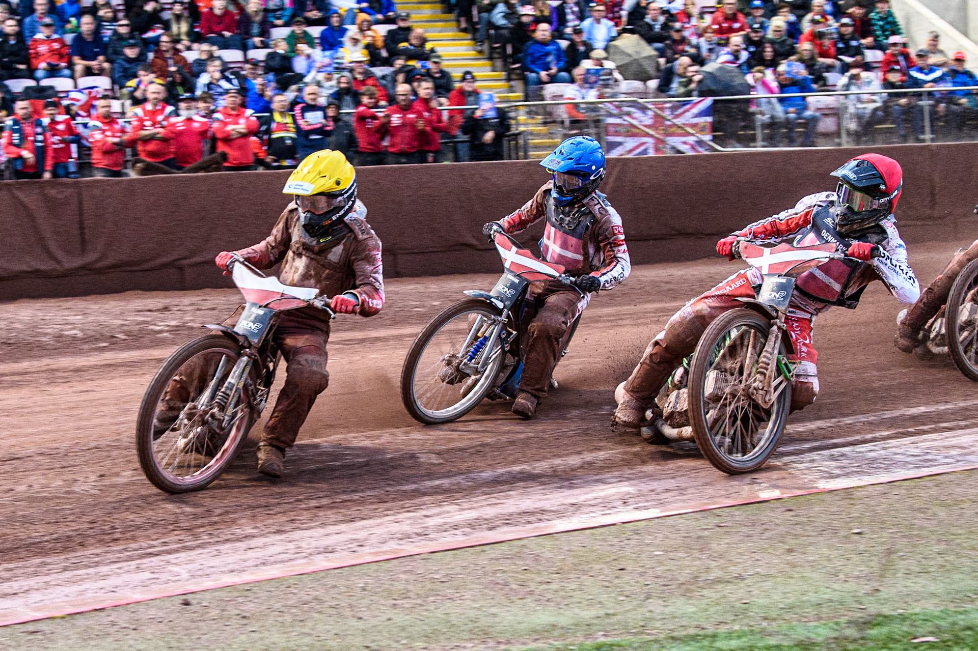 Bartosz Banbor of Poland in Yellow leading Villads Nagel of Denmark in Red and Bastian Pedersen of Denmark in Blue during the Monster Energy FIM Speedway of Nations 2 (Under 21) Final at the National Speedway Stadium, Manchester on Friday 12th July 2024. (Photo: Ian Charles | MI News)