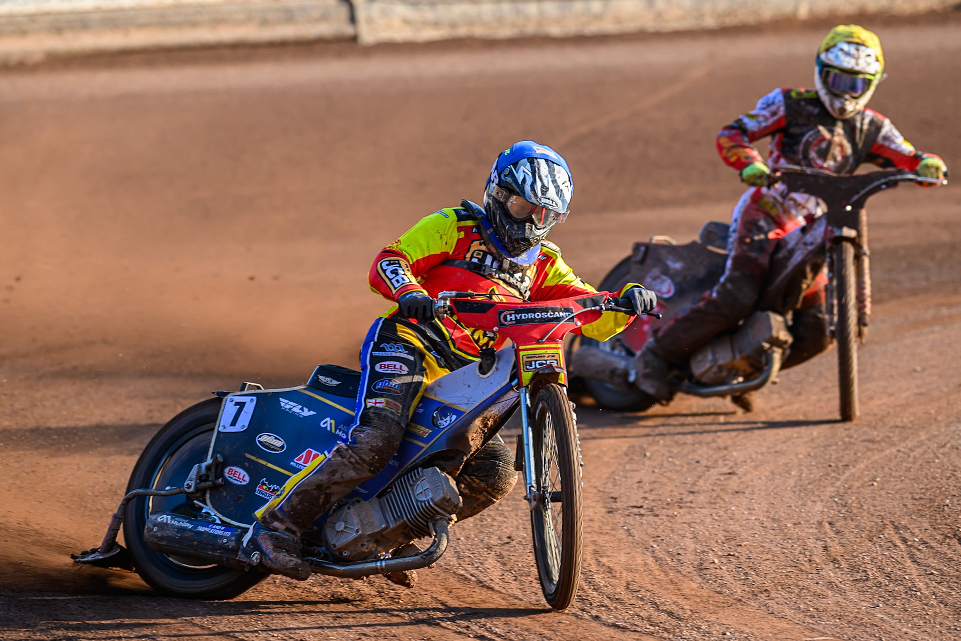 Leicester Lions' Joe Thompson in Blue leading Belle Vue Aces' Jake Mulford in Yellow during the Rowe Motor Oil Premiership match between Leicester Lions and Belle Vue Aces at the Hydroscand Arena, Leicester on Thursday 19th June 2025. (Photo: Ian Charles | MI News)