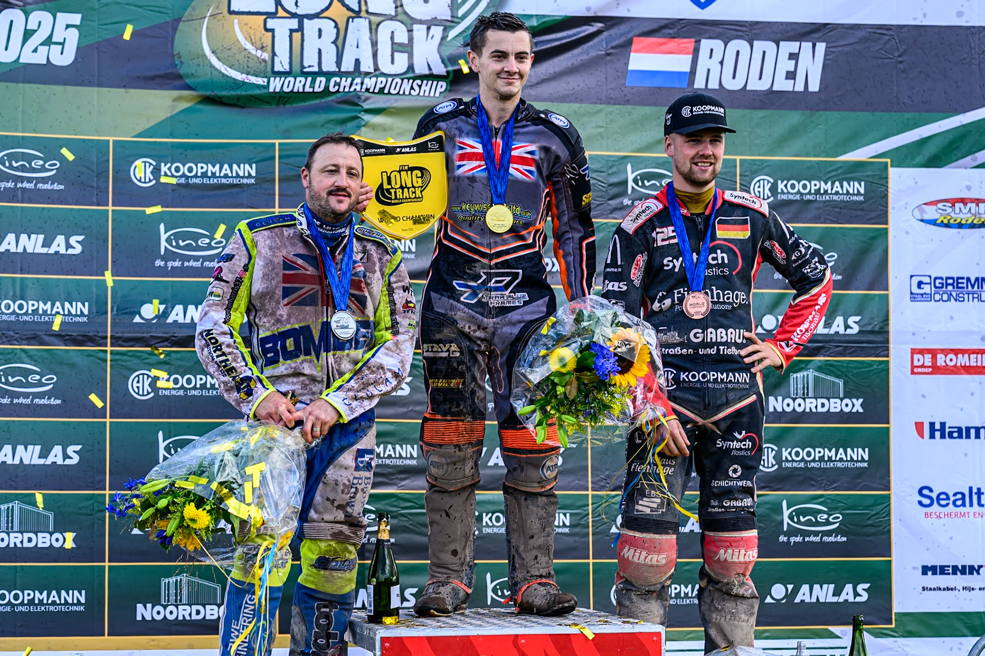 World Championship Top 3: (L to R) Chris Harris (37) of Great Britain (2nd), Zach Wajtknecht (109) of Great Britain (World Champion) Lukas Fienhage (125) of Germany (3rd) during the FIM Long Track World Championship Final 4, at the Speed Centre Roden, Netherlands on Sunday 21st September 2025. (Photo: Ian Charles | MI News)