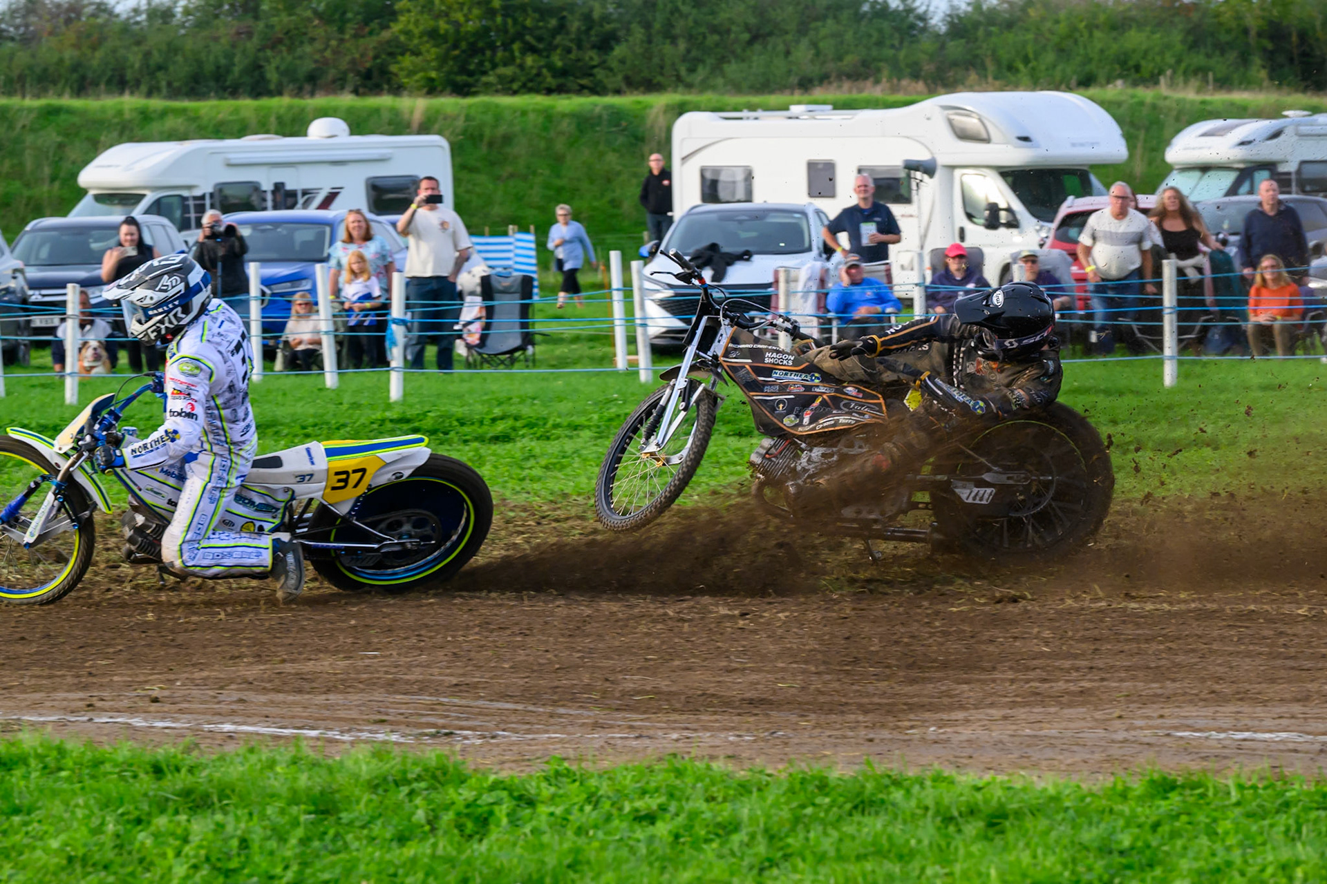 British Masters (Solos): Ashton Vale (152) catches the back wheel of Chris Harris (37)  and comes off during the British Masters Grasstrack Championship at Lower Marsh Farm, Much Hoole, Preston in Lancashire, England on Sunday 13th September 2026. (Photo: Ian Charles | MI News)