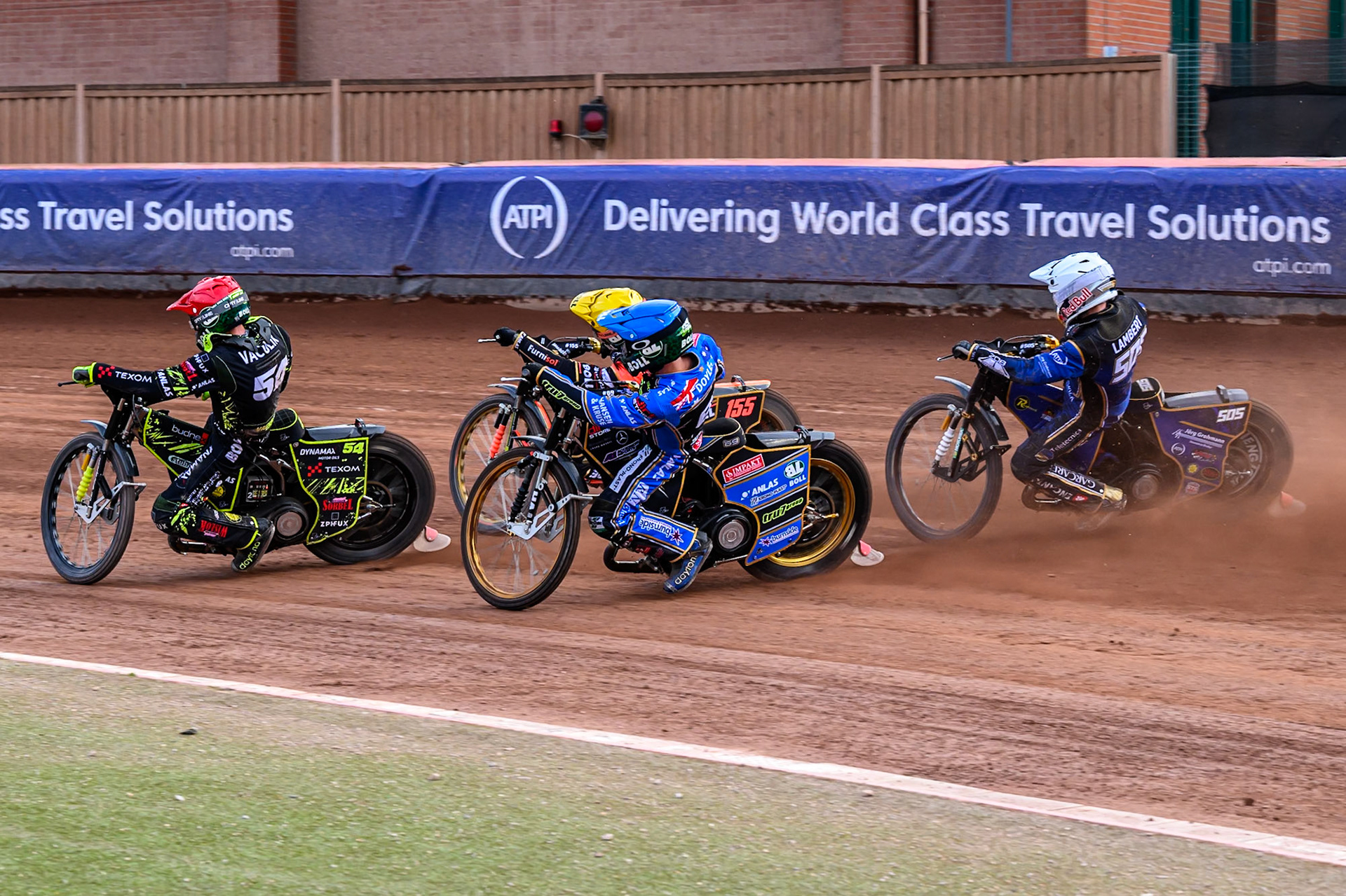 Robert Lambert (505) of Great Britain in White chases Jason Doyle (69) of Australia in Blue, Mikkel Michelsen (155) of Denmark in Yellow and Martin Vaculik (54) of Slovakia in Red during the ATPI FIM Speedway Grand Prix Round 4 at the National Speedway Stadium, Manchester, on Friday 13th June 2025. (Photo: Ian Charles | MI News)