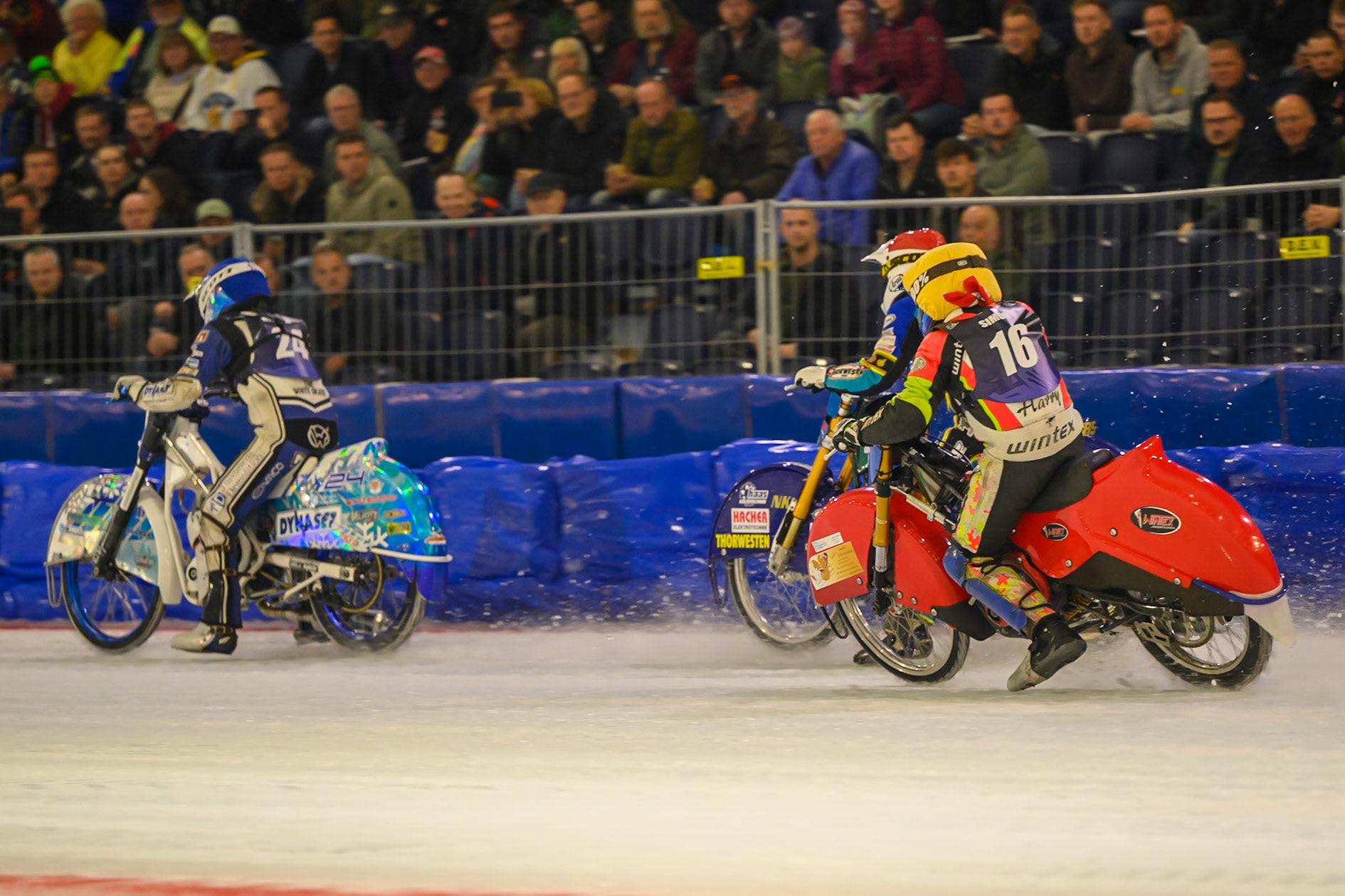 Wild Card Harald Simon (16) of Austria  in Yellow chases Luca Bauer (85) of Italy/Germany  in Red and Max Koivula (24) of Finland  in Blue during the FIM Ice Speedway Gladiators World Championship Final 3 at Ice Rink Thialf, Heerenveen on Saturday 11th April 2026. (Photo: Ian Charles | MI News)