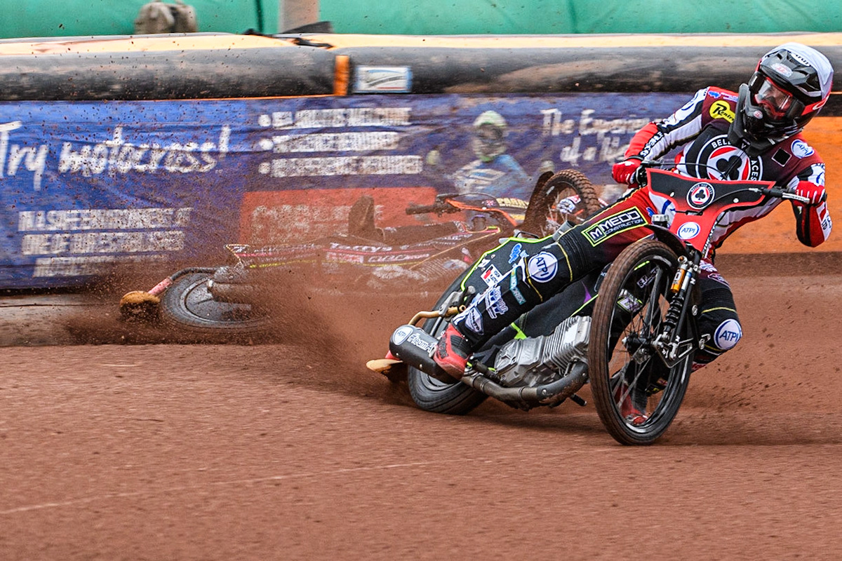 Tom Brennan (White) inside Leon Flint (Blue) as he falls in the first bend during the Sports Insure Premiership match between Wolverhampton Wolves and Belle Vue Aces at Monmore Green Stadium, Wolverhampton on Monday 10th July 2023. (Photo: Ian Charles | MI News)
