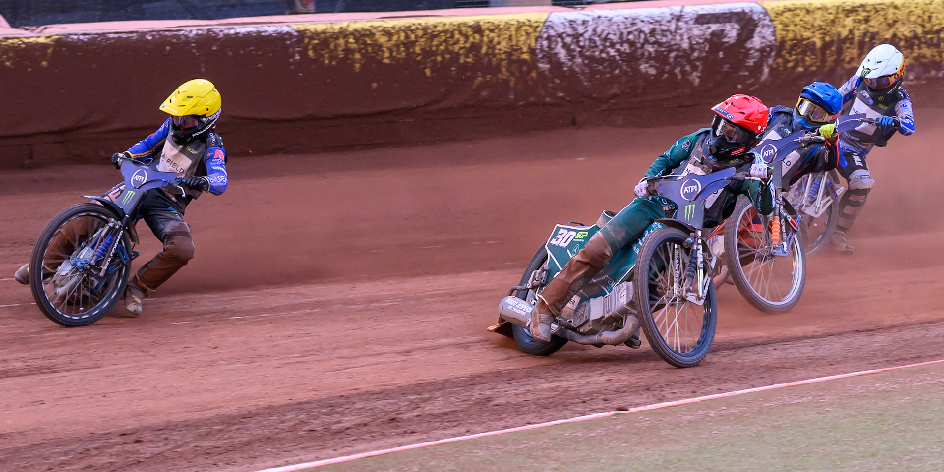 Nazar Parnitskyi (785) of Ukraine in Yellow rides outside Leon Madsen (30) of Denmark in Red with Andzejs Lebedevs (29) of Latvia in Blue and Jack Holder (25) of Australia in White behind during the ATPI  FIM Speedway GP of Manchester at the National Speedway Stadium, Manchester on Saturday 6th June 2026. (Photo: Ian Charles | MI News)