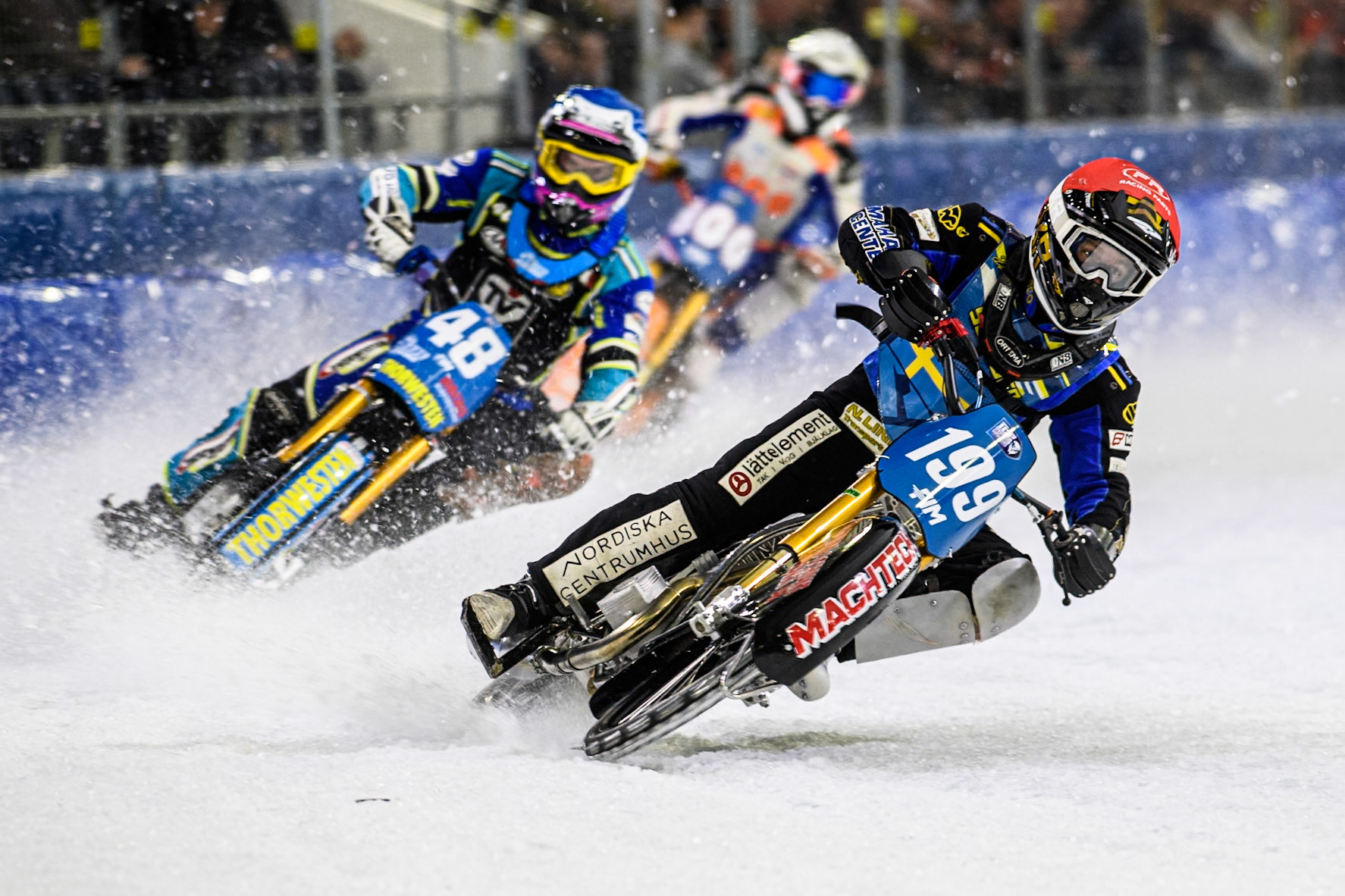 Martin Haarahiltunen (199) of Sweden in Red leading Luca Bauer (48) of Germany in Blue  and Jasper Iwema (800) of The Netherlands in White during the FIM Ice Speedway Gladiators World Championship, Final 3 at the Ice Stadium, Thialf, Heerenveen on Saturday 5th April 2025. (Photo: Ian Charles | MI News)
