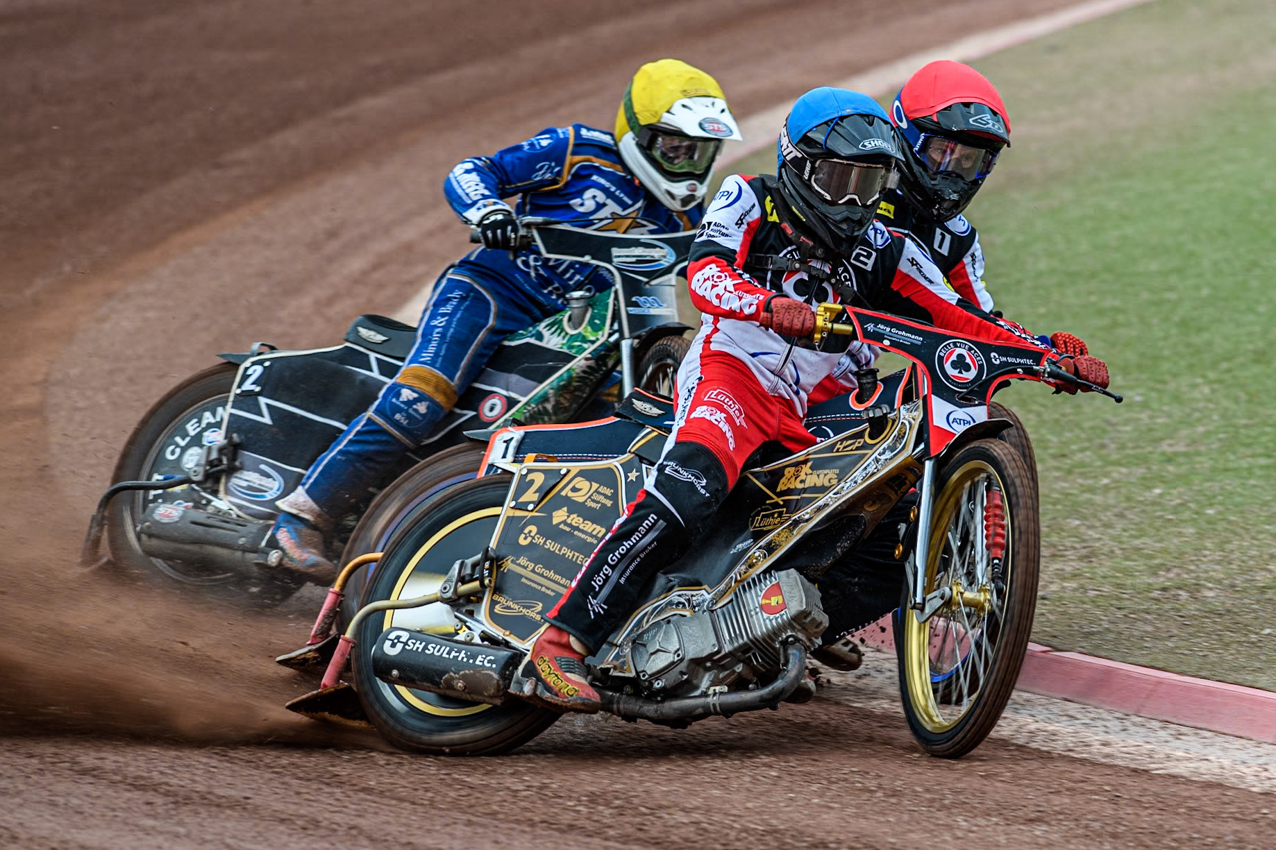 Belle Vue Aces' Norick Blodorn in Blue and Belle Vue Aces' Brady Kurtz in Red hold out King Lynn Stars' Guest Richard Lawson during the Rowe Motor Oil Premiership match between Belle Vue Aces and King's Lynn Stars at the National Speedway Stadium, Manchester on Monday 20th May 2024. (Photo: Ian Charles | MI News)