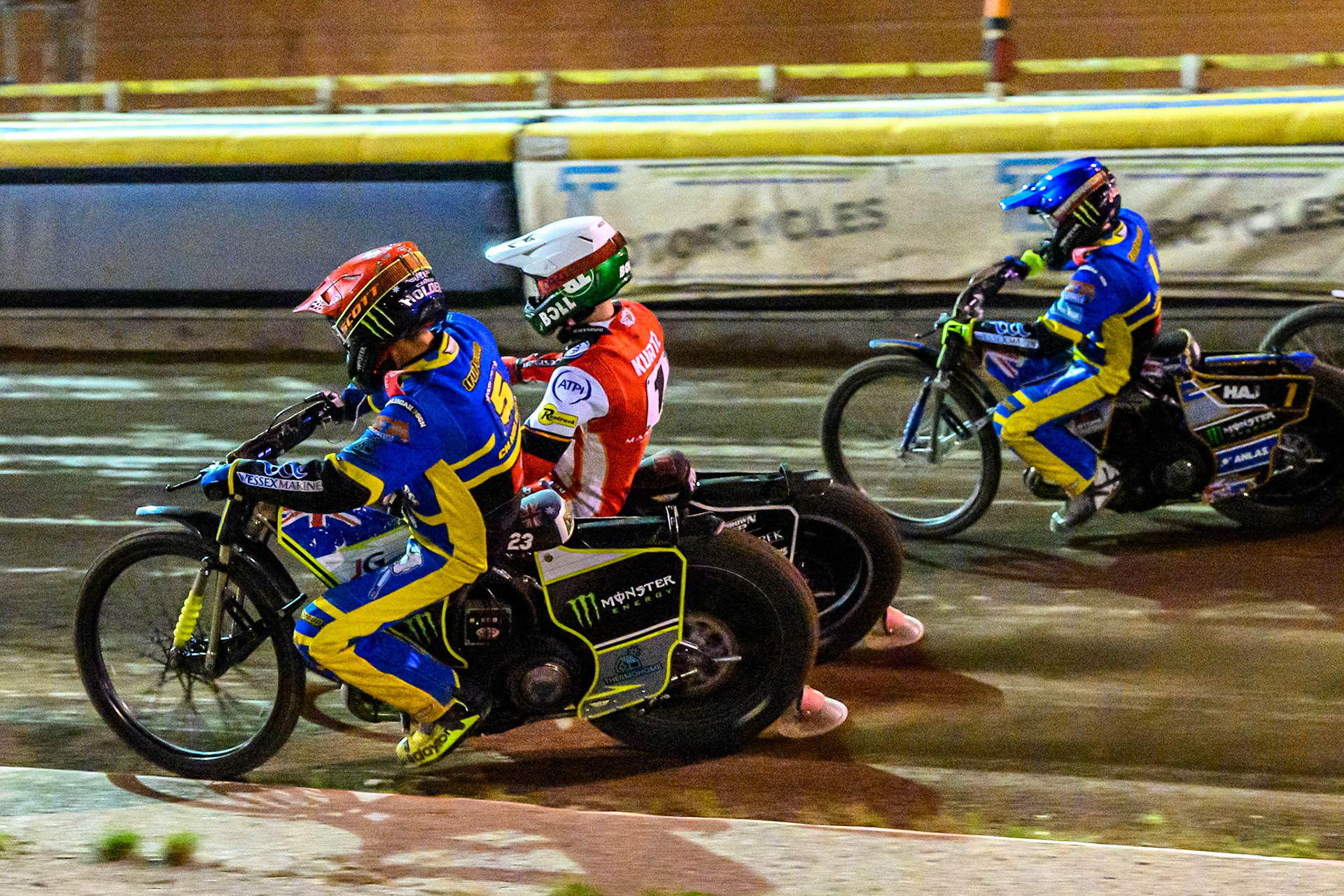 Chris Holder of Sheffield Tigers  in Red rides inside Brady Kurtz of Belle Vue Aces   in White and Jack Holder of Sheffield Tigers  in Blue during the Rowe Motor Oil Premiership match between Sheffield Tigers and Belle Vue Aces at Owlerton Stadium, Sheffield on Monday 11th August 2025. (Photo: Ian Charles | MI News)