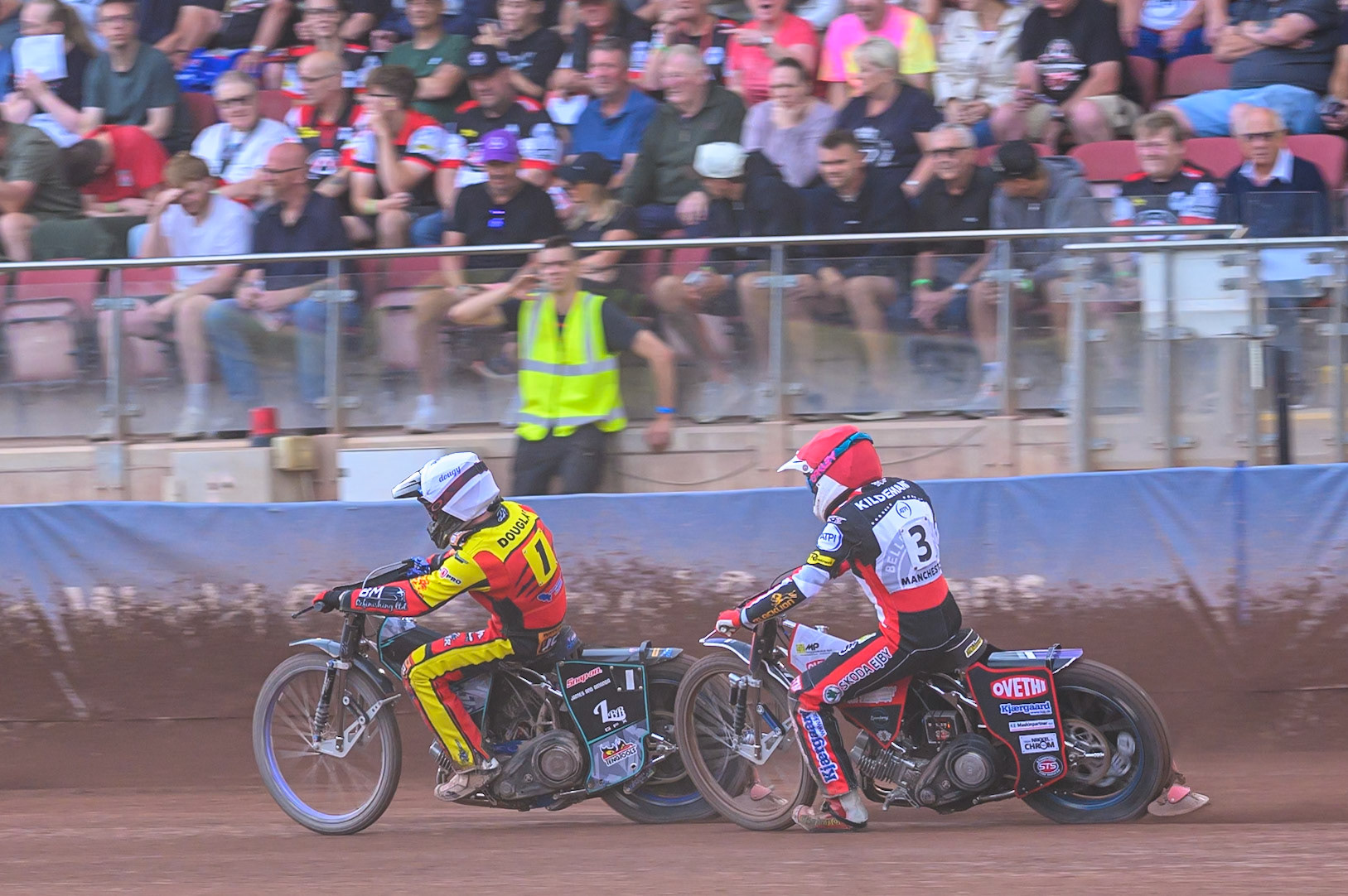 Ryan Douglas of Leicester Lions in White leading Peter Kildemand of Belle Vue Aces in Red during the Rowe Motor Oil Premiership match between Belle Vue Aces and Leicester Lions at the National Speedway Stadium, Manchester on Monday 3rd August 2026. (Photo: Ian Charles | MI News)