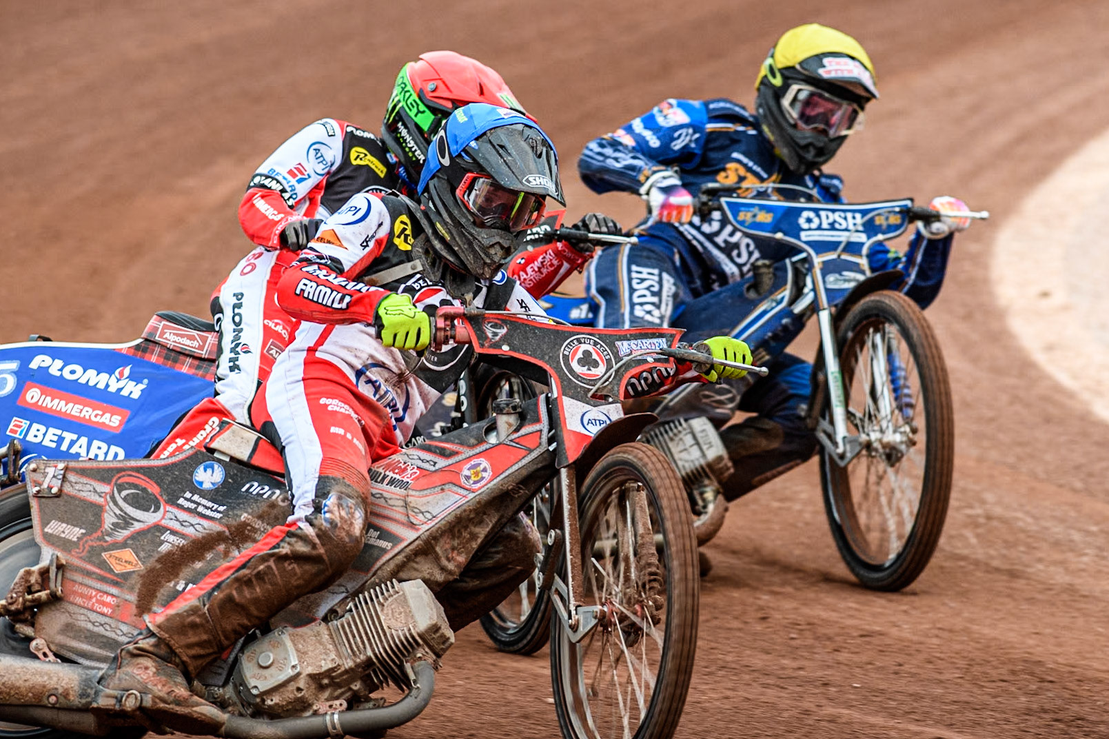 Belle Vue Aces' Connor Bailey in Blue Belle Vue Aces' Dan Bewley in Red and King Lynn Stars' Anders Rowe in Yellow in action during the Rowe Motor Oil Premiership match between Belle Vue Aces and King's Lynn Stars at the National Speedway Stadium, Manchester on Monday 20th May 2024. (Photo: Ian Charles | MI News)