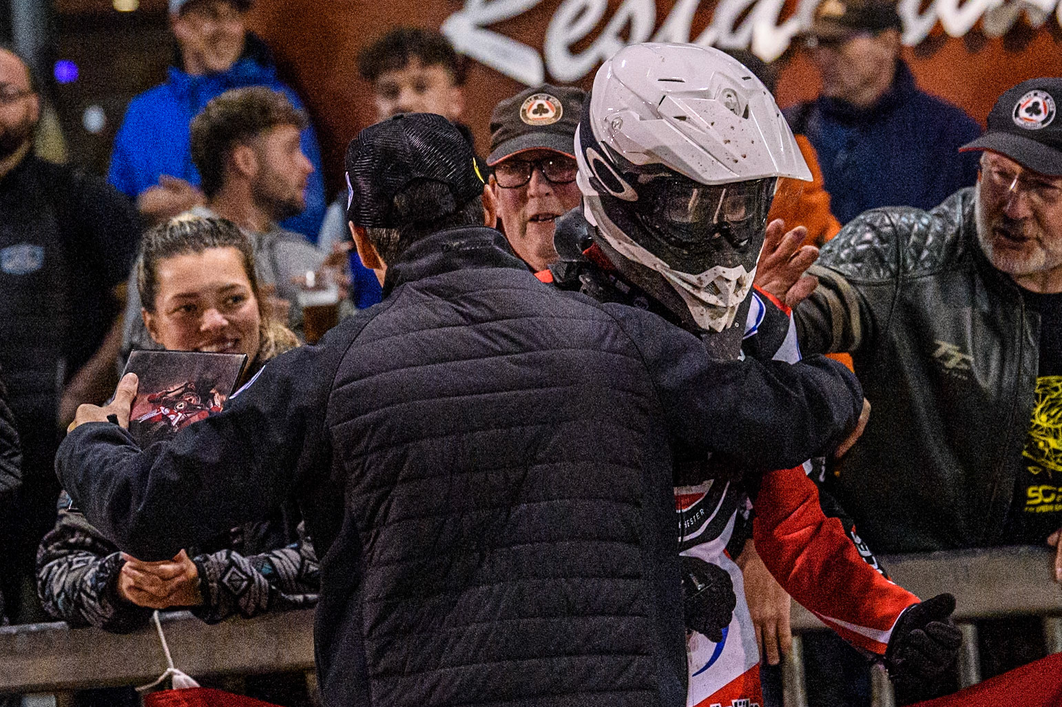Belle Vue Aces' Team Manager Mark Lemon hugs Belle Vue Aces' Antti Vuolas  after his match winning ride during the Rowe Motor Oil Premiership Play Off Semi Final 2nd leg between Sheffield Tigers and Belle Vue Aces at Owlerton Stadium, Sheffield on Thursday 19th September 2024. (Photo: Ian Charles | MI News)
