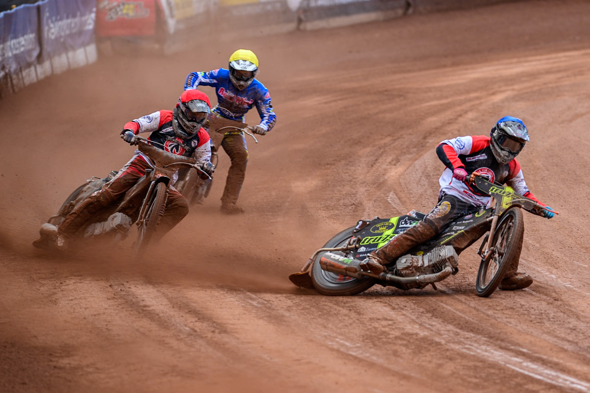 Belle Vue Colts' Connor King in Blue leading Belle Vue Colts' Jack Kingston  in Red and Oxford Chargers' Max Broadhurst  in Yellow during the WSRA National Development League match between Belle Vue Colts and Oxford Chargers at the National Speedway Stadium, Manchester on Sunday 1st June 2025. (Photo: Ian Charles | MI News)