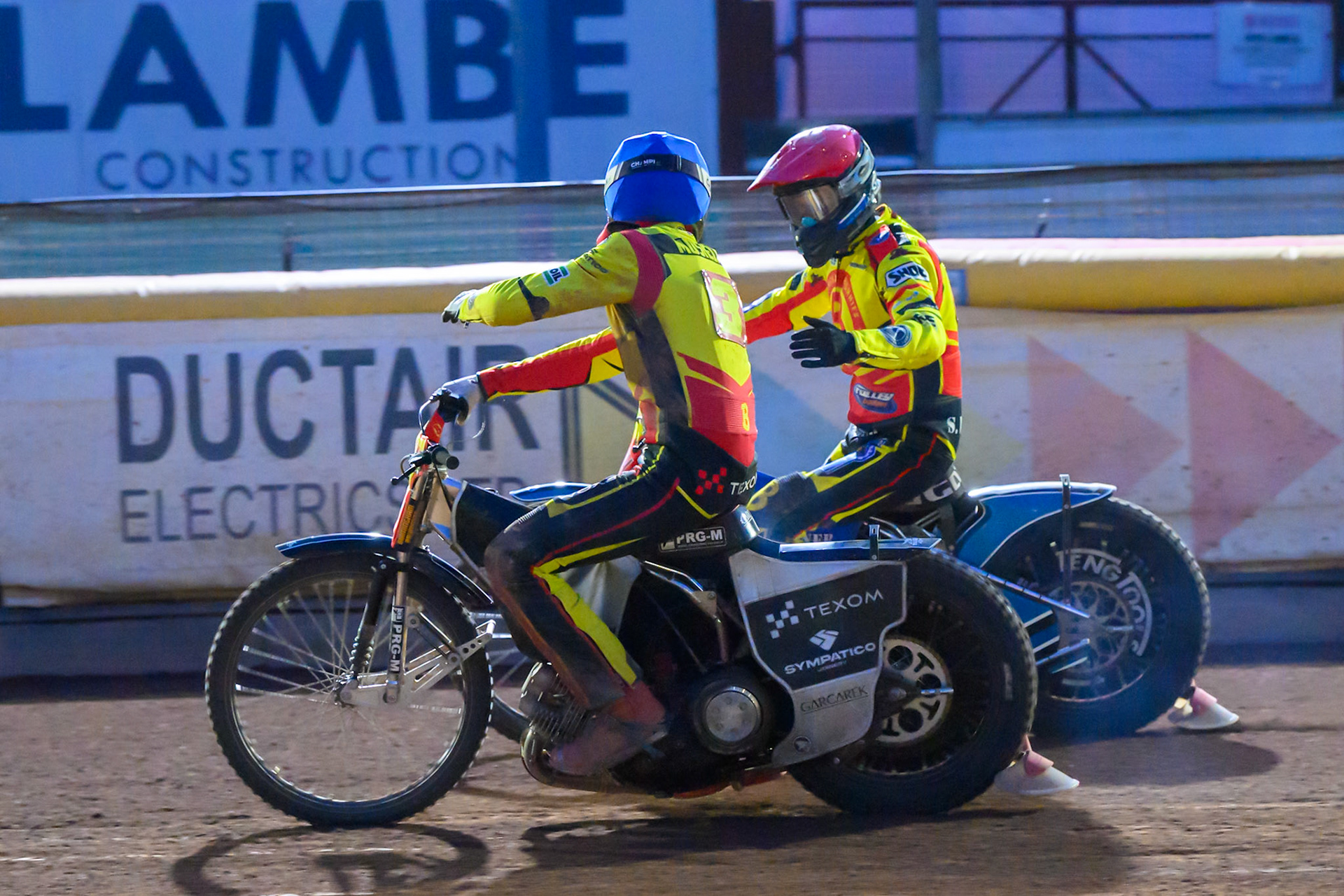 Birmingham Brummies' Tobiasz Musielak in Blue and Birmingham Brummies' Matej Zagar in Red congratulate each other after their match winning ride in Heat 15 during the Rowe Motor Oil Premiership match between Birmingham Brummies and Belle Vue Aces at Perry Bar Stadium, Birmingham on Monday 2nd June 2025. (Photo: Ian Charles | MI News)