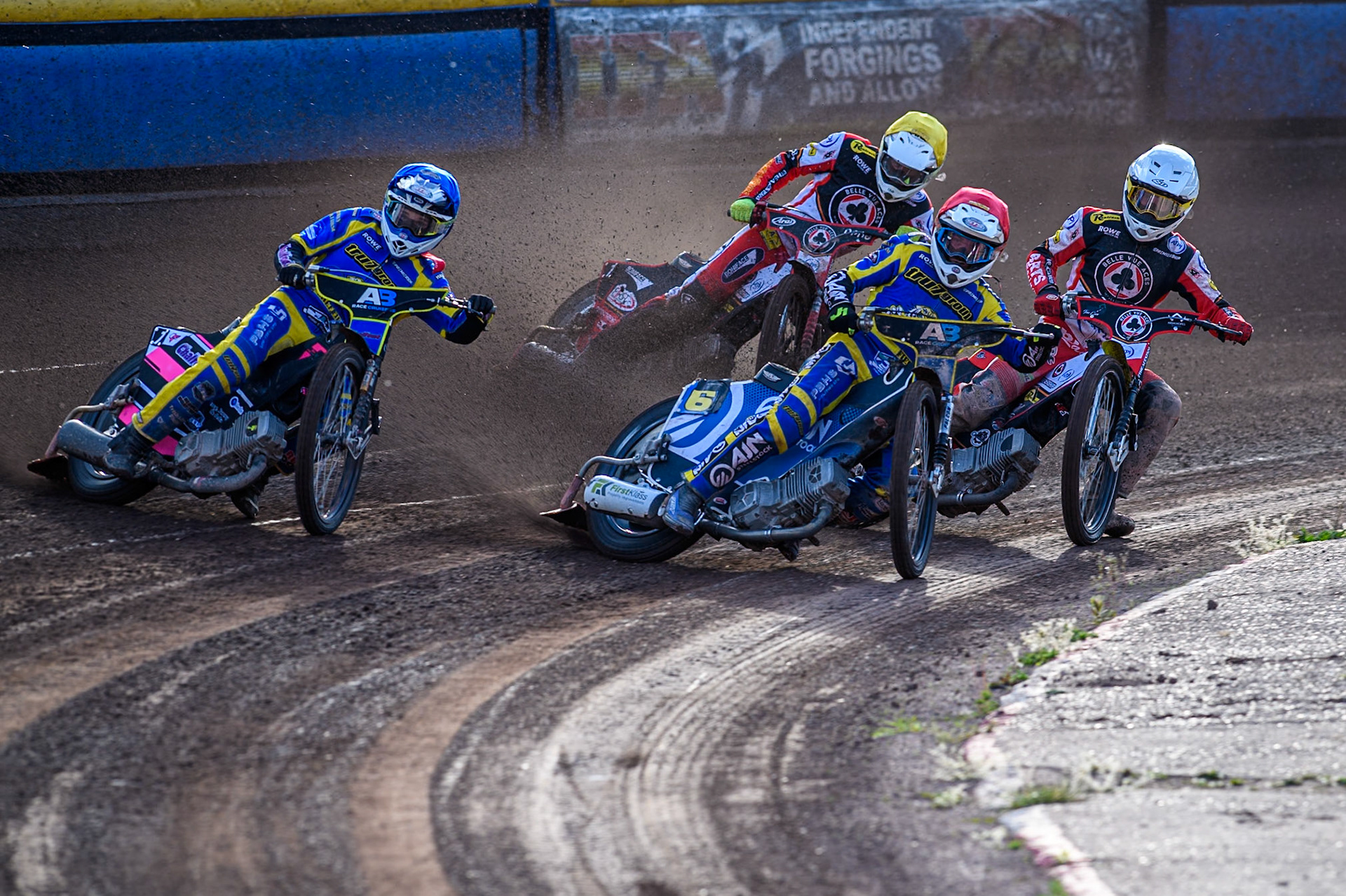 Lewis Kerr of Sheffield Tigers in Red and Leon Flint of Sheffield Tigers in Blue leading Tate Zischke of Belle Vue Aces in White and Jake Mulford of Belle Vue Aces in Blue during the Rowe Motor Oil Premiership match between Sheffield Tigers and Belle Vue Aces at Owlerton Stadium, Sheffield on Monday 5th May 2025. (Photo: Ian Charles | MI News)