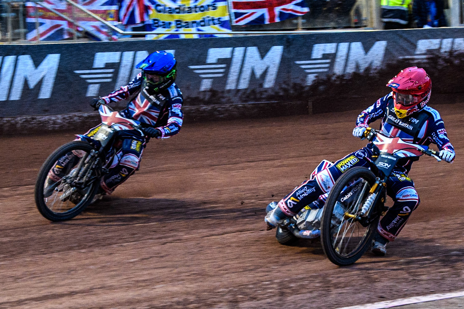 Robert Lambert of Great Britain in Red rides inside Dan Bewley of Great Britain in Blue during the Monster Energy FIM Speedway of Nation Final at the National Speedway Stadium, Manchester on Saturday 13th July 2024. (Photo: Ian Charles | MI News)