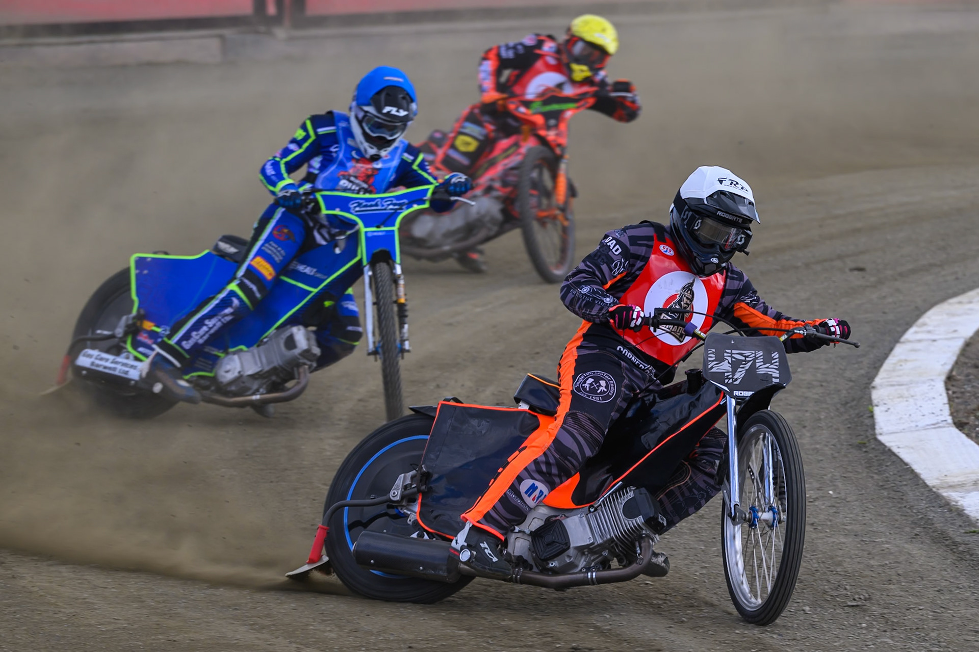 Jack Roberts of NDL Nomads    in White leading Arran Butcher of Buxton Bulls  in Blue and Alex Spooner of NDL Nomads   in Yellow during the  Challenge match between Buxton Bulls and NDL Nomads at Hi-Edge Speedway, Buxton on Sunday 19th April 2026. (Photo: Ian Charles | MI News)