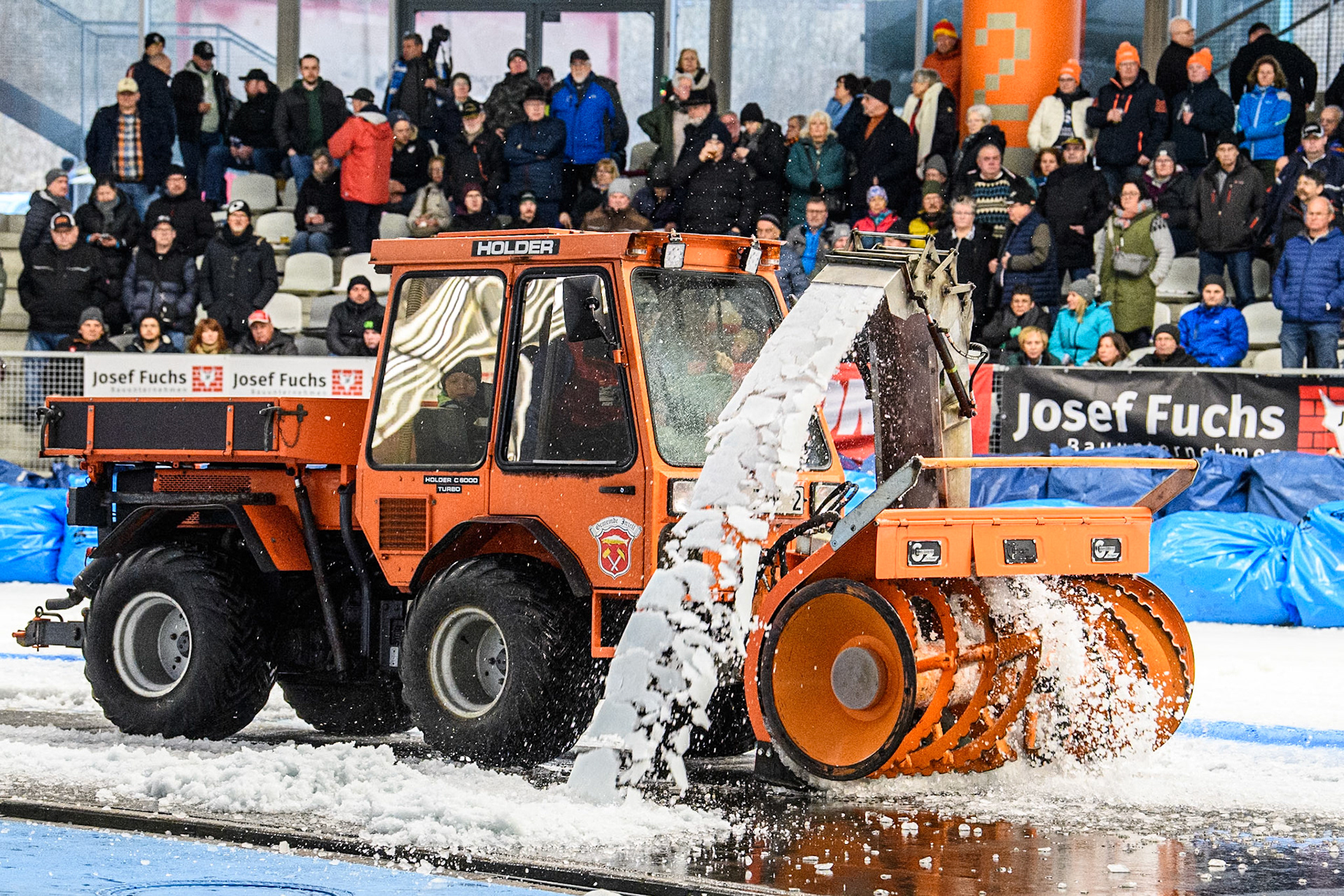 Track staff clear the snow from the track during track maintenance in the interval during the Ice Speedway Gladiators World Championship Final 2 at Max-Aicher-Arena, Inzell on Sunday 16th March 2025. (Photo: Ian Charles | MI News)