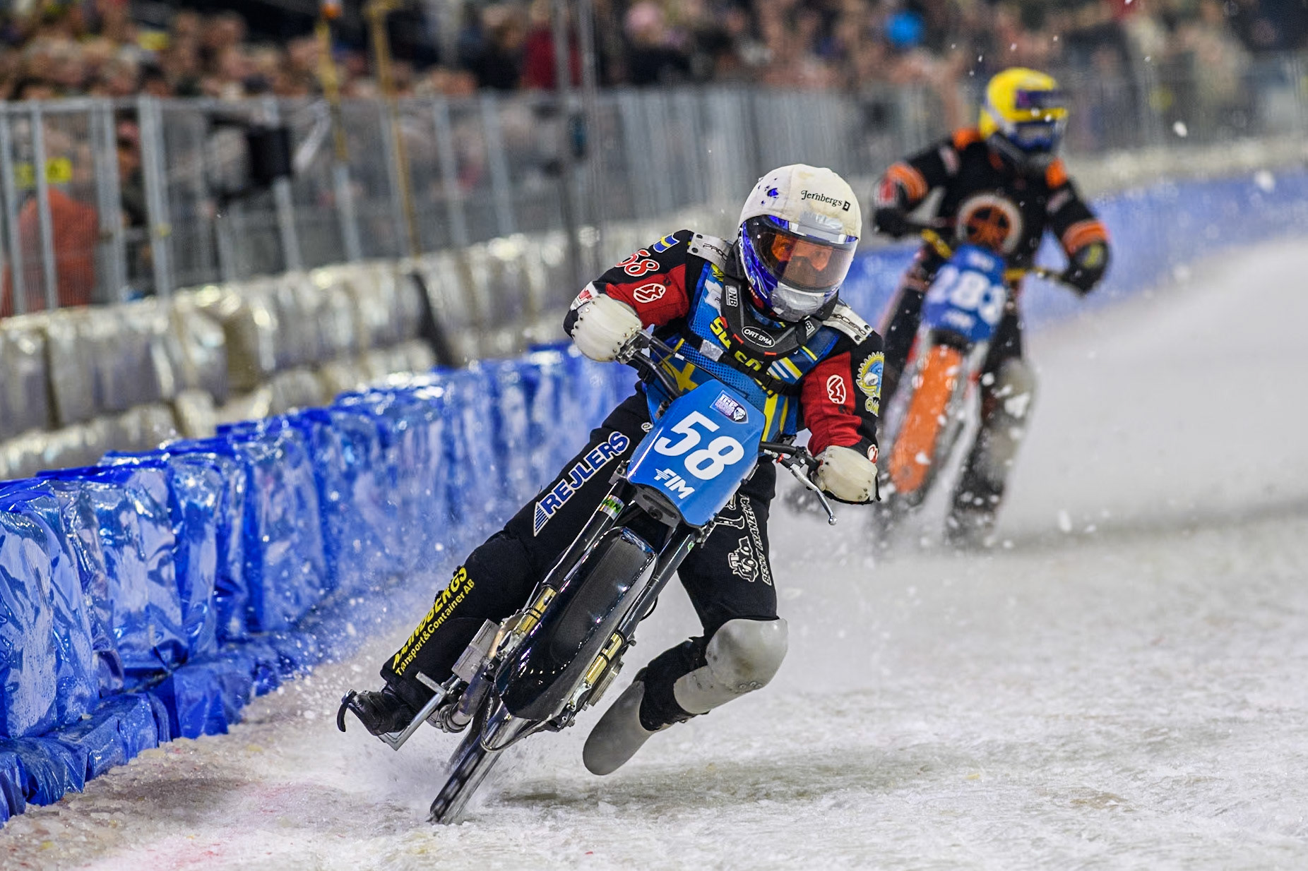 Sweden's Stefan Svensson (58) in White leading Netherland's Sebastian Reitsma (283) in Yellow during the FIM Ice Speedway Gladiators World Championship Final 4 at Ice Rink Thialf, Heerenveen on Sunday 7th April 2024. (Photo: Ian Charles | MI News)