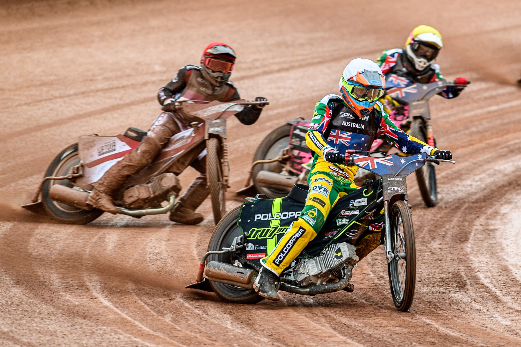 Keynan Rew of Australia in White leading James Pearson of Australia in Yellow and  Nikita Kaulins of Latvia in Red during the Monster Energy FIM Speedway of Nations 2 (Under 21) Final at the National Speedway Stadium, Manchester on Friday 12th July 2024. (Photo: Ian Charles | MI News)
