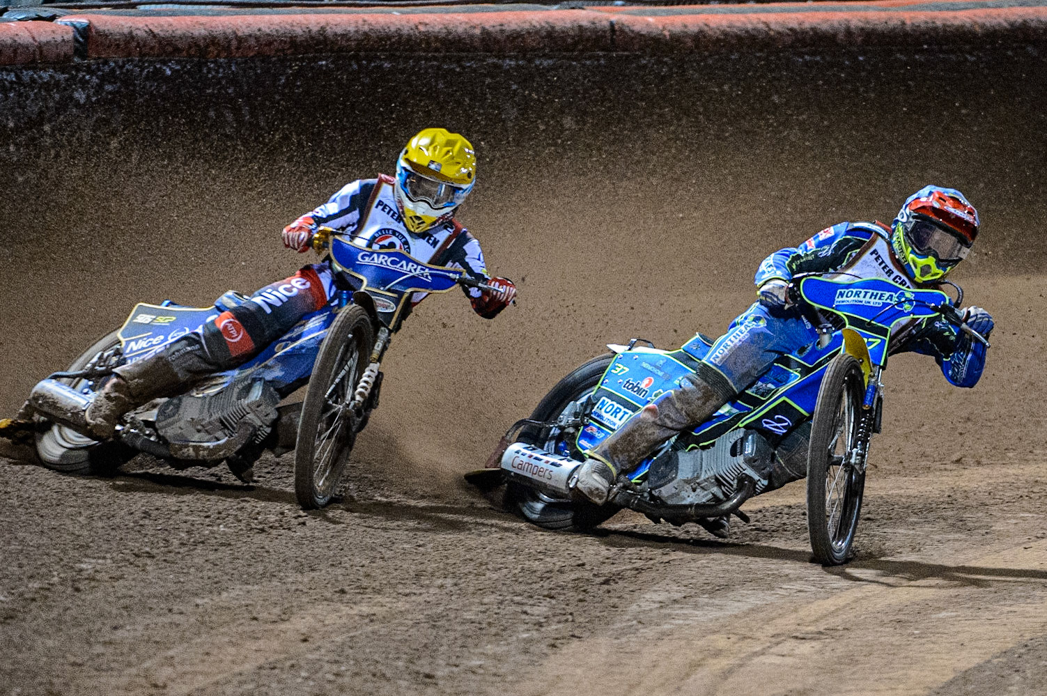 Chris Harris (Blue) leads Robert Lambert  (Yellow) during the Peter Craven Memorial Trophy  at the National Speedway Stadium, Manchester on Monday 3rd April 2023. (Photo: Ian Charles | MI News)