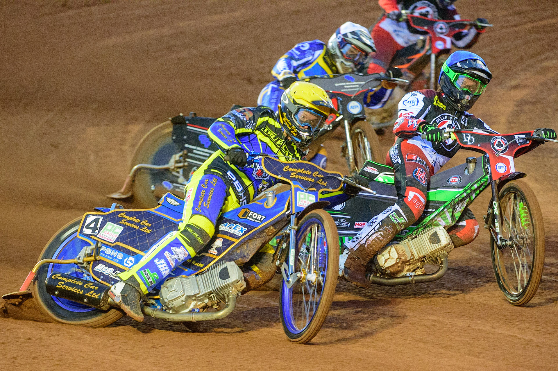 MANCHESTER, UK.  MAR 28TH.  Kyle Howarth of Sheffield  (Yellow) outside Charles Wright of Belle Vue  (Blue) with Richie Worrall of Sheffield  (White) behind during the SGB Premiership League Cup match between Belle Vue Aces and Sheffield Tigers at the National Speedway Stadium, Manchester on Monday 28th March 2022. (Credit: Ian Charles | MI News)