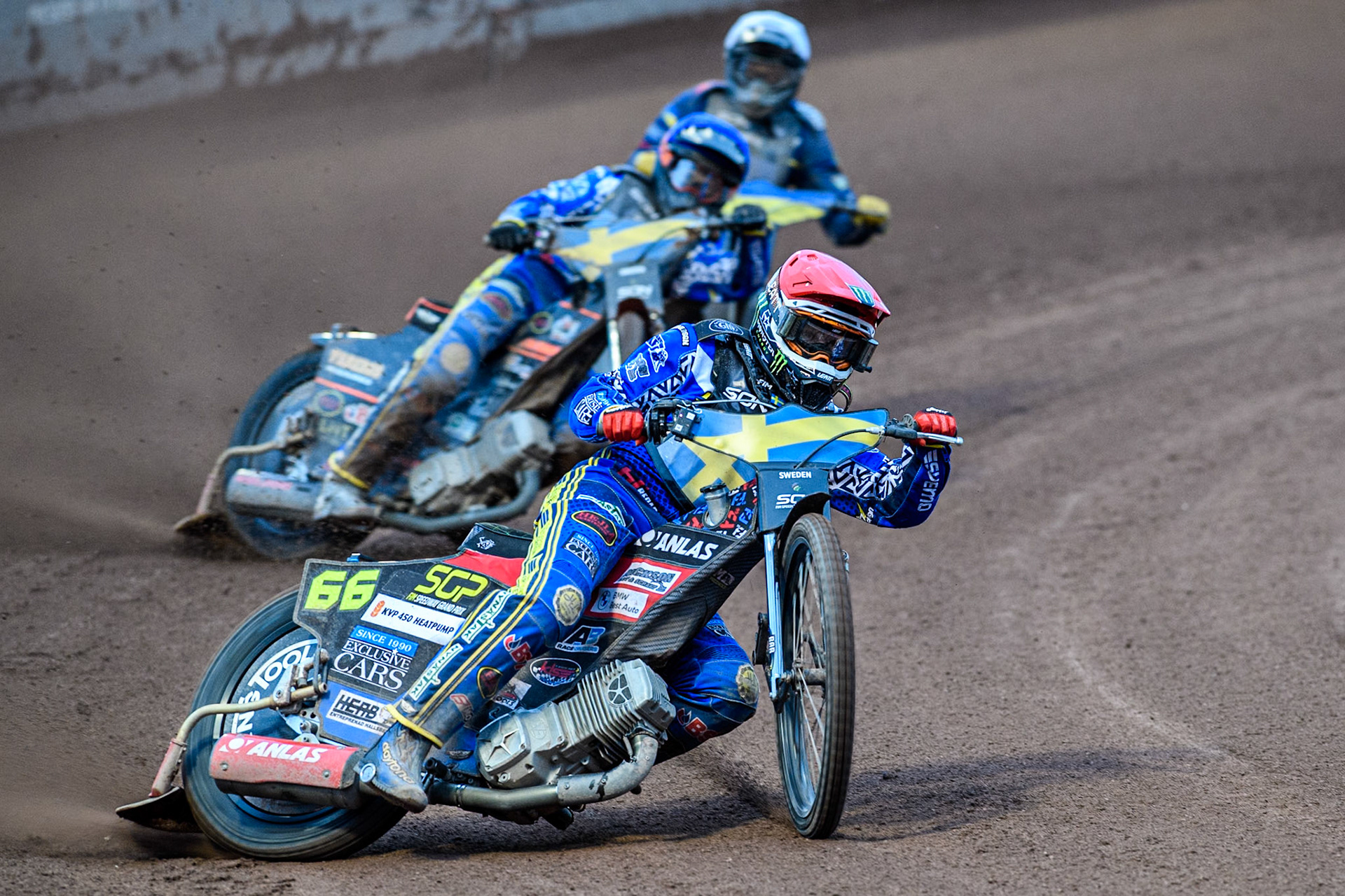 Fredrik Lindgren of Sweden in Red leading Jacob Thorssell of Sweden in Blue and Stanislav Melnychuk of Ukraine in White during the Monster Energy FIM Speedway of Nations Semi-Final 1 at the National Speedway Stadium, Manchester on Tuesday 9th July 2024. (Photo: Ian Charles | MI News)