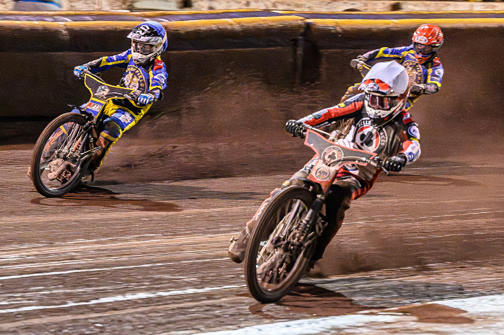 Zach Cook of Belle Vue Aces in White on the inside of Jye Etheridge of Sheffield Tigers in Blue  with Leon Flint of Sheffield Tigers in Red  behind during the Rowe Motor Oil Premiership Grand Final 1st Leg match between Sheffield Tigers and Belle Vue Aces at Owlerton Stadium, Sheffield on Monday 12th October 2026. (Photo: Ian Charles | MI News)
