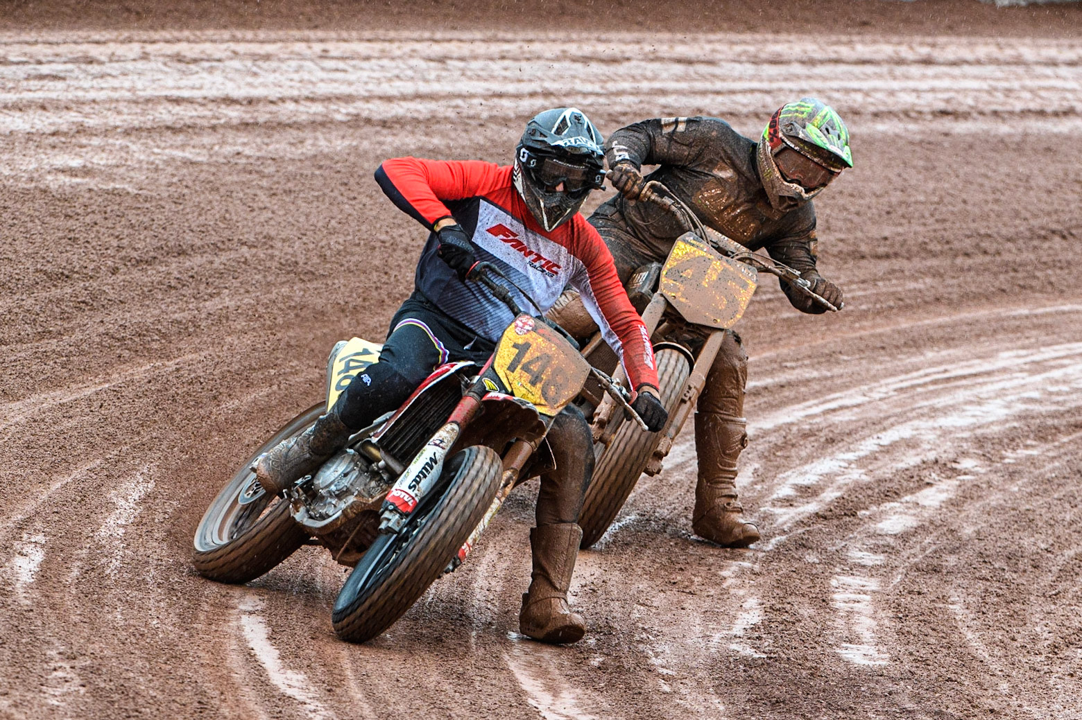 Vittorio Emanuele Marzotto (148) from Italy leads Matias Lorenzato (45) from Argentina during the FIM World Flat Track Championship Round 1 at the National Speedway Stadium, Manchester on Saturday 5th August 2023. (Photo: Ian Charles | MI News)