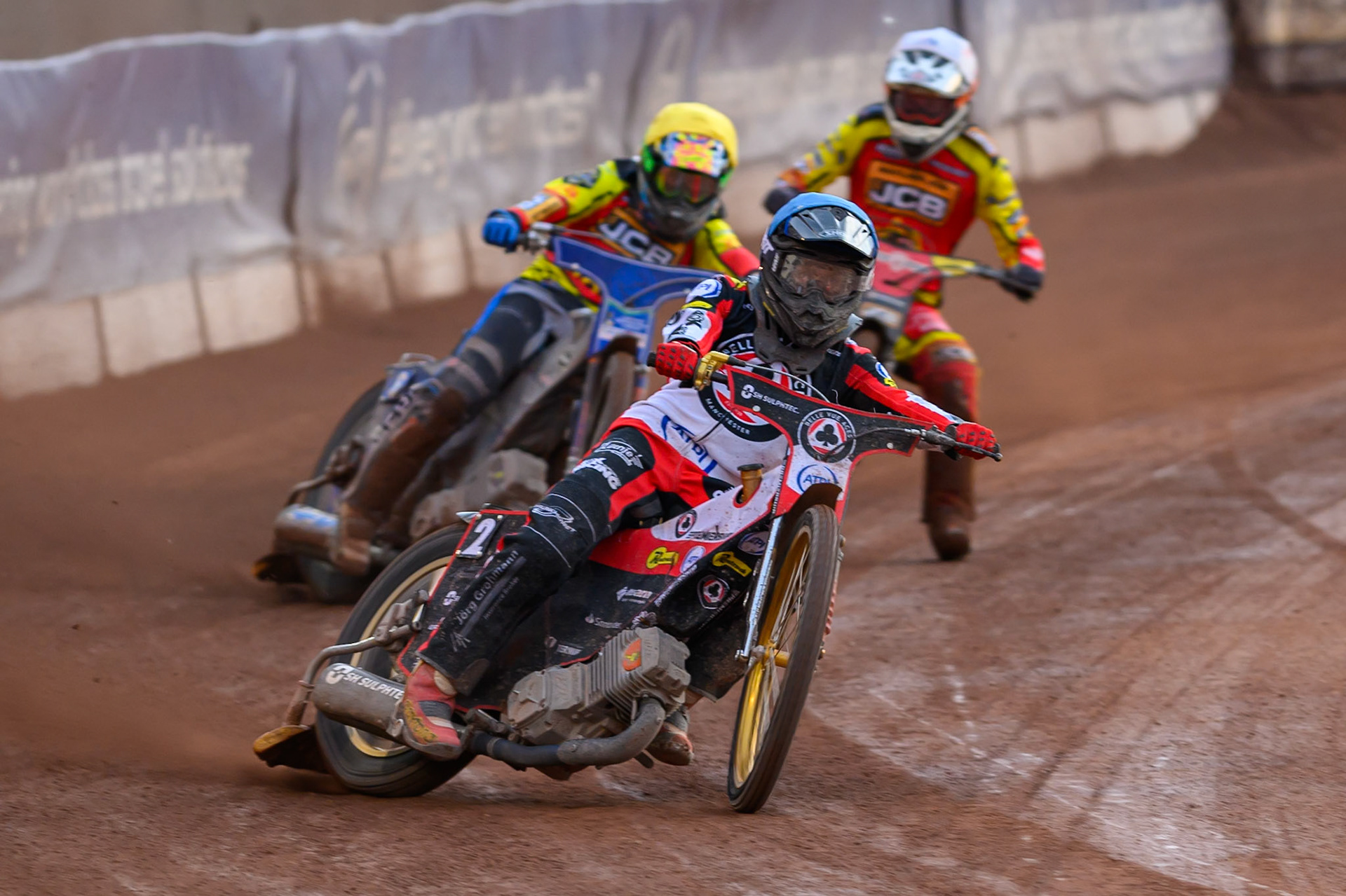 Norick Blödorn of Belle Vue Aces in Blue leading Jonas Jeppesen Guest rider for Leicester Lions in Yellow and Sam Masters of Leicester Lions in White during the Rowe Motor Oil Premiership match between Belle Vue Aces and Leicester Lions at the National Speedway Stadium, Manchester on Monday 3rd August 2026. (Photo: Ian Charles | MI News)