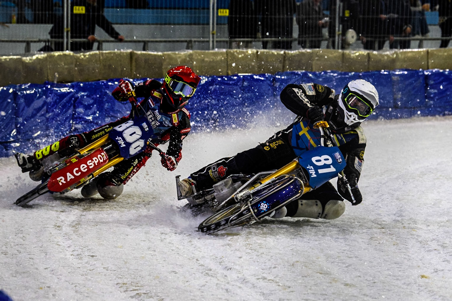 Sweden"s Jimmy Olsén (81) in White rides inside Netherlands' Jasper Iwema (800) in Red during the FIM Ice Speedway Gladiators World Championship Final 4 at Ice Rink Thialf, Heerenveen on Sunday 7th April 2024. (Photo: Ian Charles | MI News)