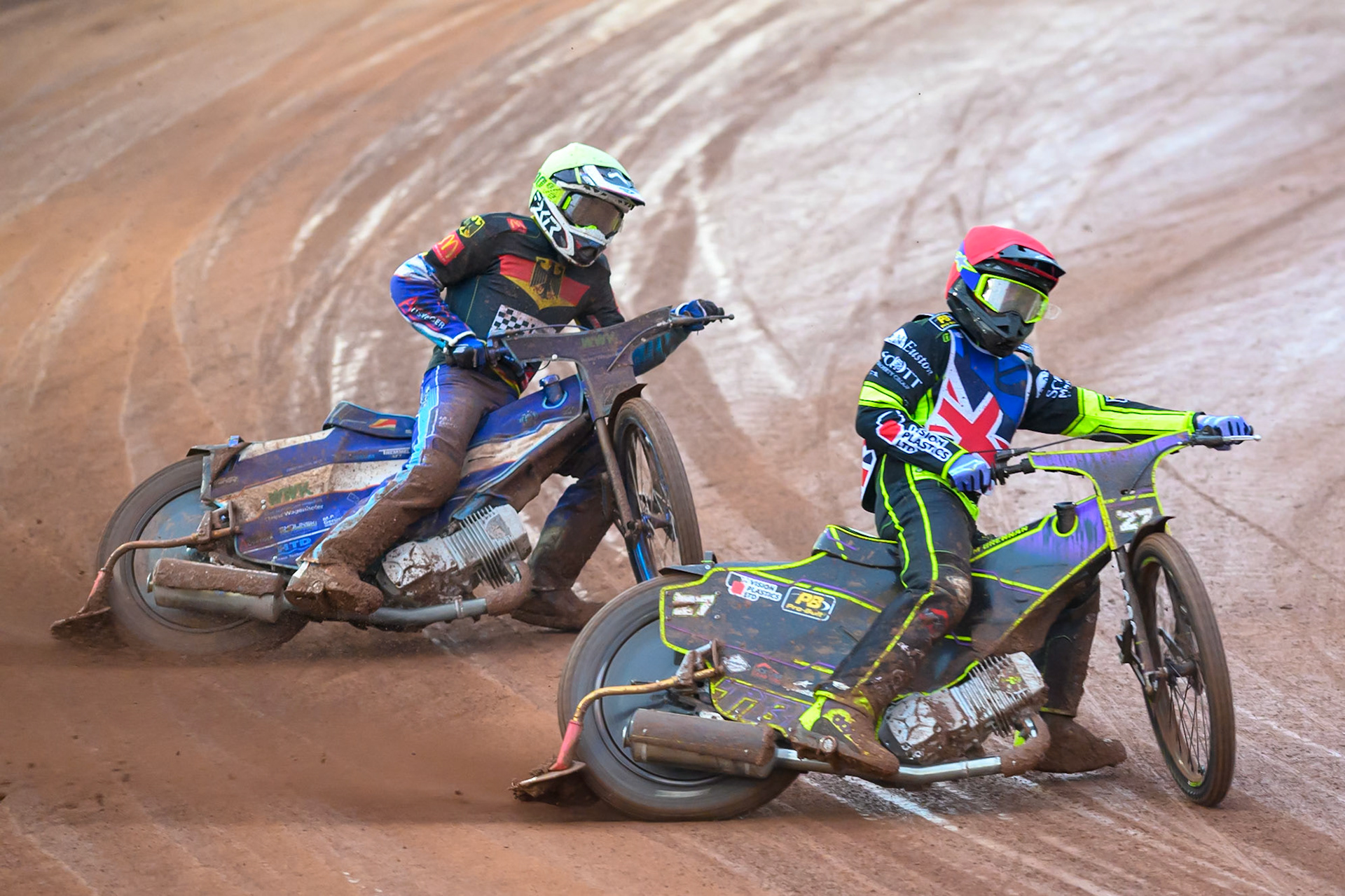 Reserve Tom Brennan of Great Britain in Red leading Mario Hausl of Germany in Yellow during the Speedway GP Qualifying Round 3 at Allied Ashfield Stadium, Glasgow on Saturday 30th May 2026. (Photo: Ian Charles | MI News)
