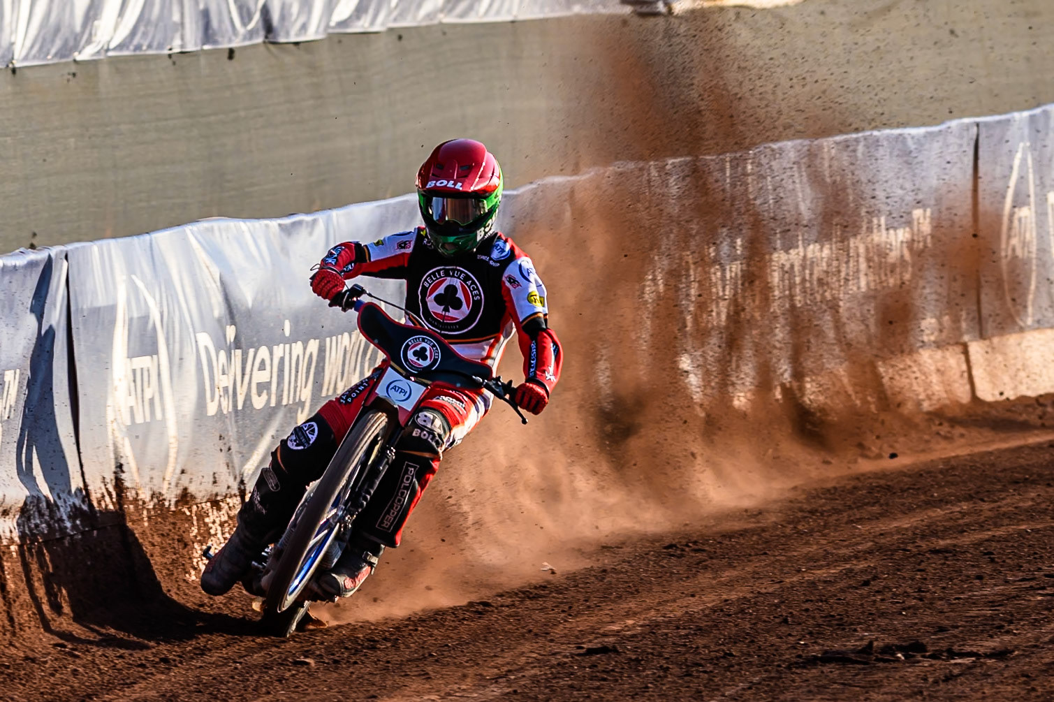 Belle Vue Aces' Brady Kurtz picks up some drive from the edge of the safety fence during the Rowe Motor Oil Premiership match between Belle Vue Aces and Leicester Lions at the National Speedway Stadium, Manchester on Monday 14th July 2025. (Photo: Ian Charles | MI News)