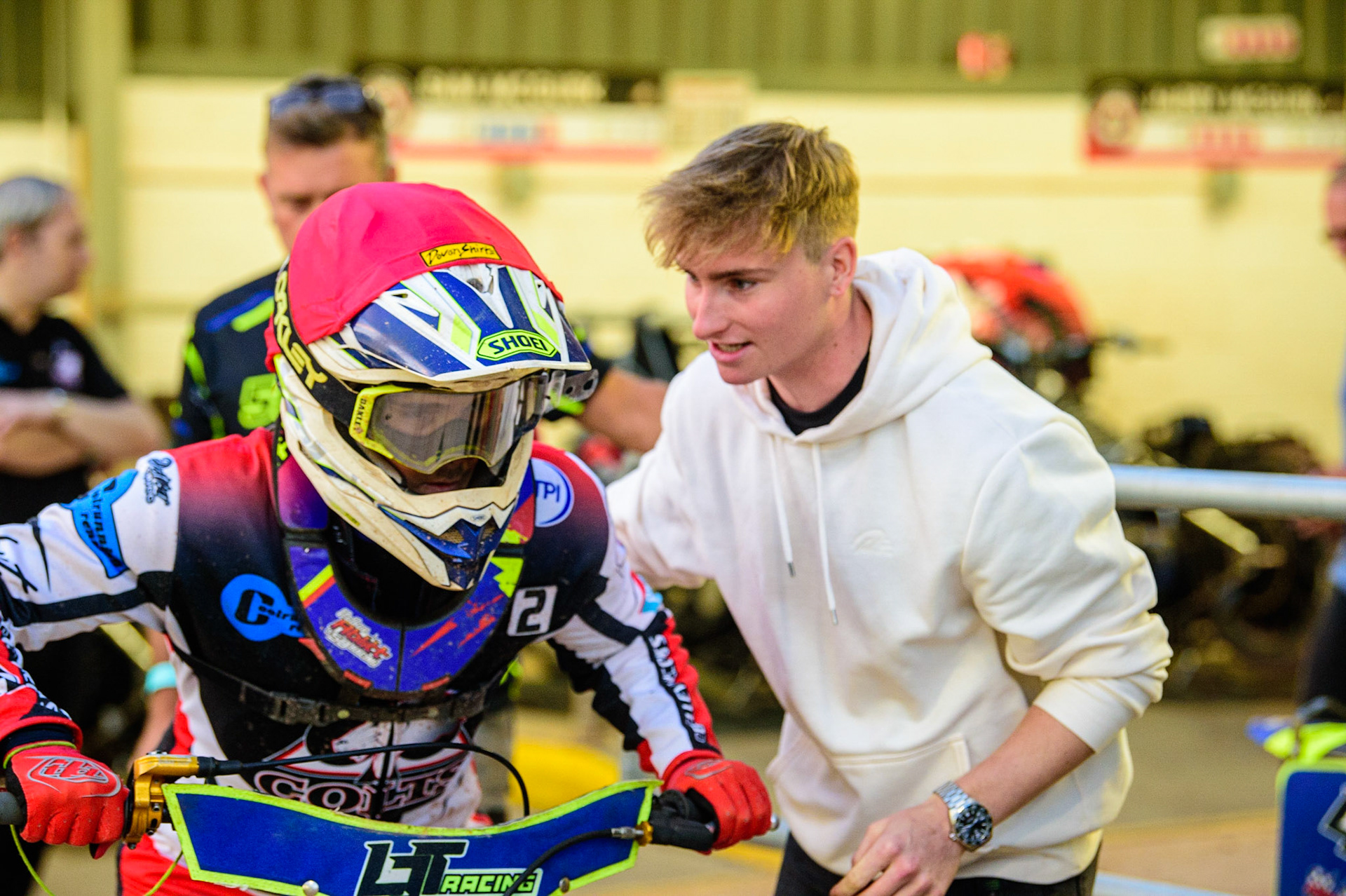 Belle Vue Aces rider Tom Brennan (right) gives some encouragement to Nathan Ablitt  before his heat during the National Development League match between Belle Vue Aces and Leicester Lions at the National Speedway Stadium, Manchester on Friday 19th August 2022. (Credit: Ian Charles | MI News)