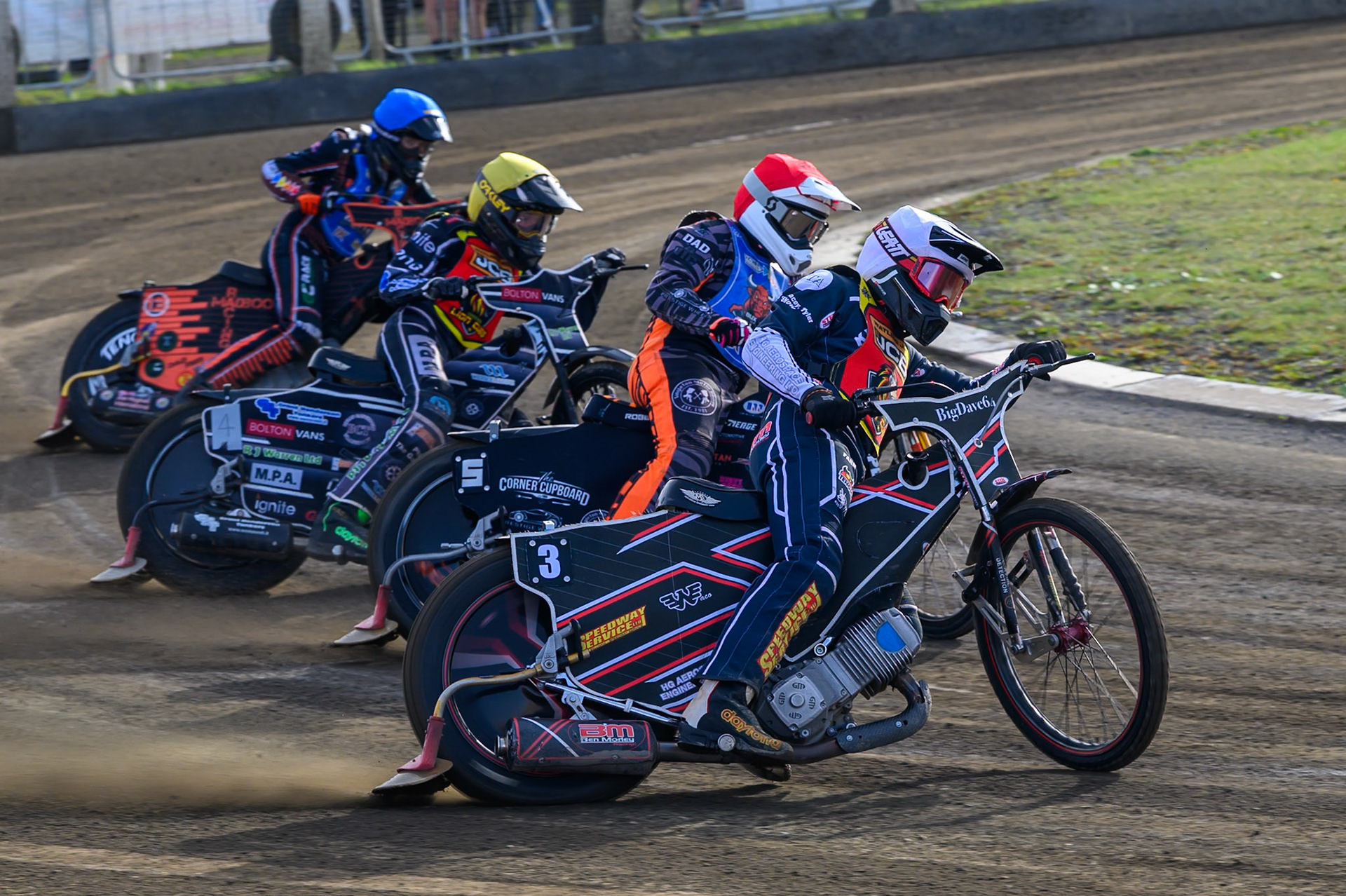 Ben Morley of Leicester Lion Cubs  in White leading Jack Roberts of Buxton Bulls   in Red , Seth Norman of Leicester Lion Cubs   in Yellow  and Bailey Fellows, Guest Rider for Buxton Bulls   in Blue during the WSRA National Development League match between Buxton Bulls and Leicester Lion Cubs at Hi-Edge Speedway, Buxton on Sunday 4th October 2026. (Photo: Ian Charles | MI News)
