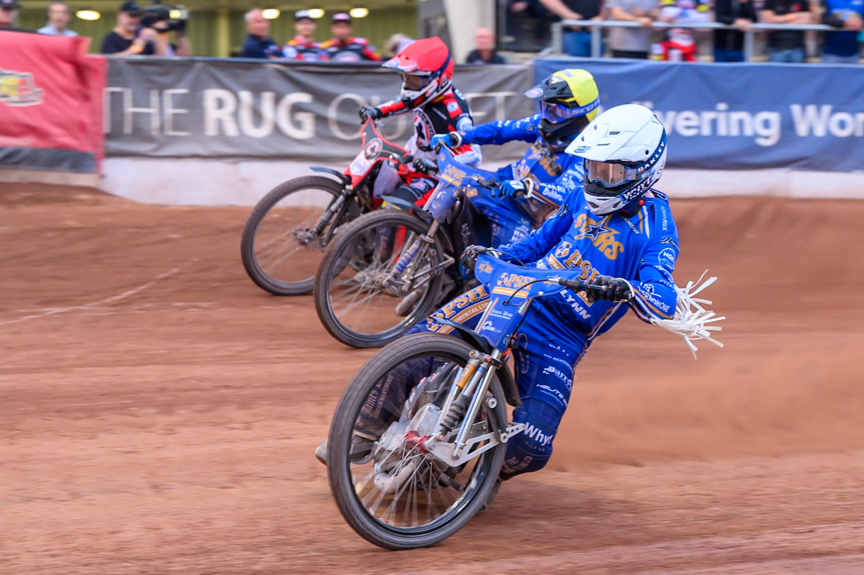 Cooper Rushen of Kings Lynn Stars in White rides inside Jody Scott of Kings Lynn Stars in Yellow and Zach Cook of Belle Vue Aces in Red  during the Rowe Motor Oil Premiership match between Belle Vue Aces and King's Lynn Stars at the National Speedway Stadium, Manchester on Monday 29th June 2026. (Photo: Ian Charles | MI News)