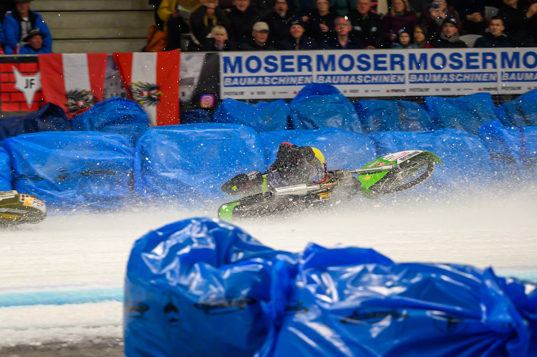 Johann Weber (33) of Germany  spins off behind Heikki Huusko (67) of Finland in Blue during the Ice Speedway Gladiators World Championship Final 1 at Max-Aicher-Arena, Inzell on Saturday 14th March 2026. (Photo: Ian Charles | MI News)