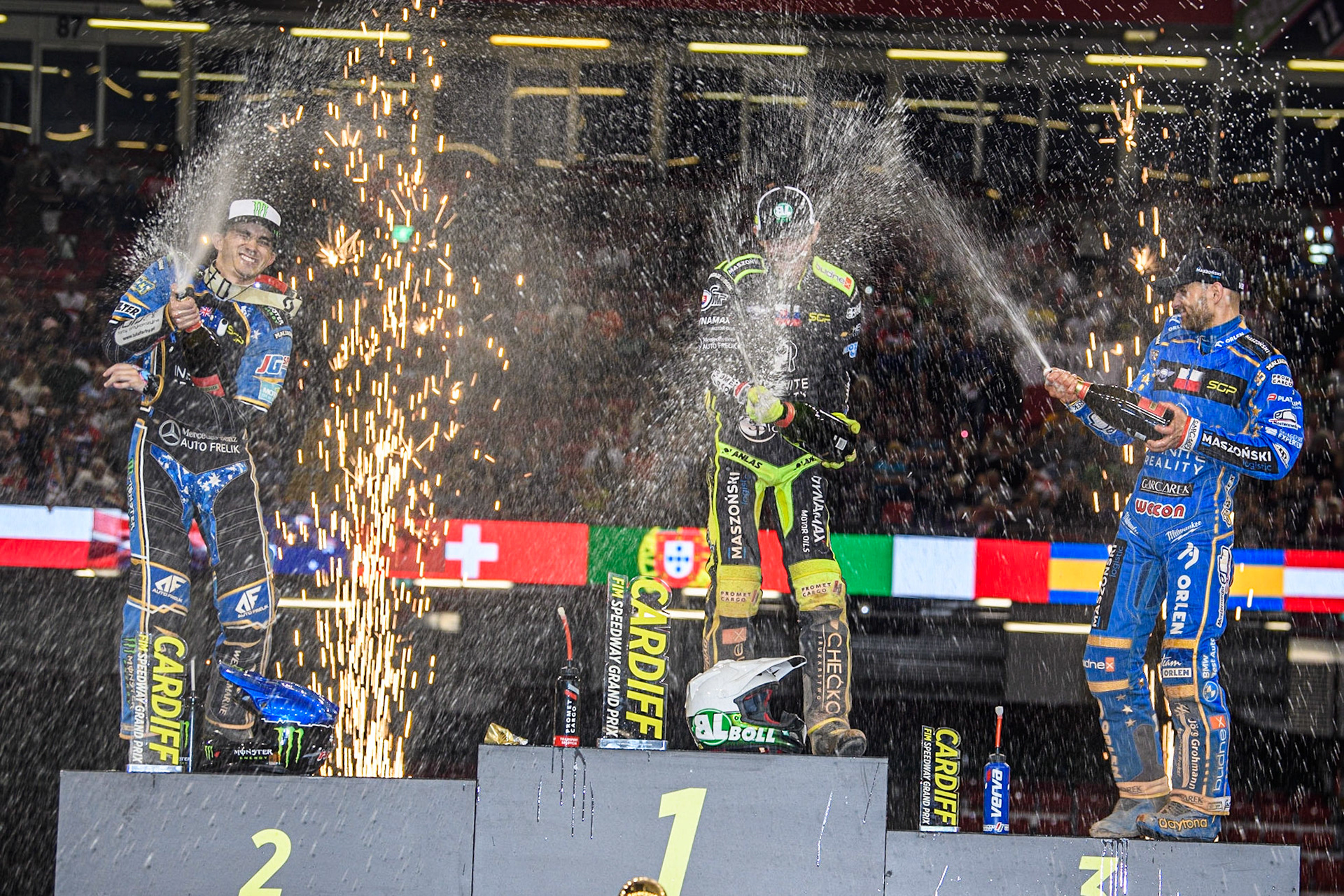 The Champagne is sprayed liberally by the Top 3 during the FIM Speedway Grand Prix of Great Britain at the Principality Stadium, Cardiff on Saturday 2nd September 2023. (Photo: Ian Charles | MI News)