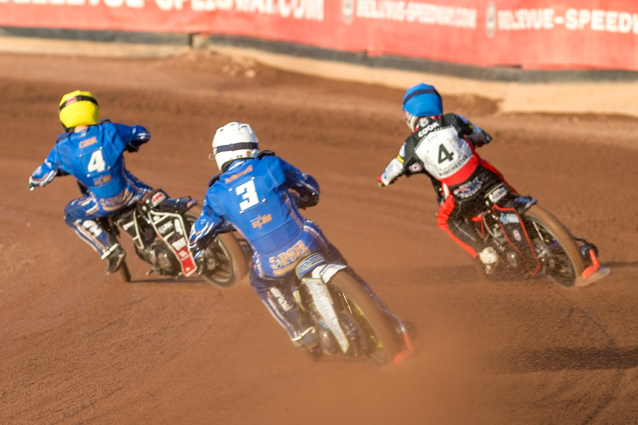 Chris Harris of Kings Lynn Stars in White chases Zach Cook of Belle Vue Aces in Blue and Ben Cook of Kings Lynn Stars in Yellow during the Rowe Motor Oil Premiership match between Belle Vue Aces and King's Lynn Stars at the National Speedway Stadium, Manchester on Monday 10th August 2026. (Photo: Ian Charles | MI News)