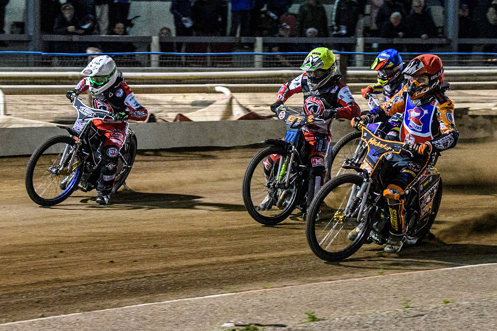 Steelers' Mickie Simpson in Red rides inside Belle Vue Colts' Billy Budd in Yellow and Belle Vue Colts' Jack Shimelt in White with Steelers' Harrison Rogers in Blue behind during the WSRA National Development League match between Steelers and Belle Vue Colts at Owlerton Stadium, Sheffield on Monday 5th May 2025. (Photo: Ian Charles | MI News)