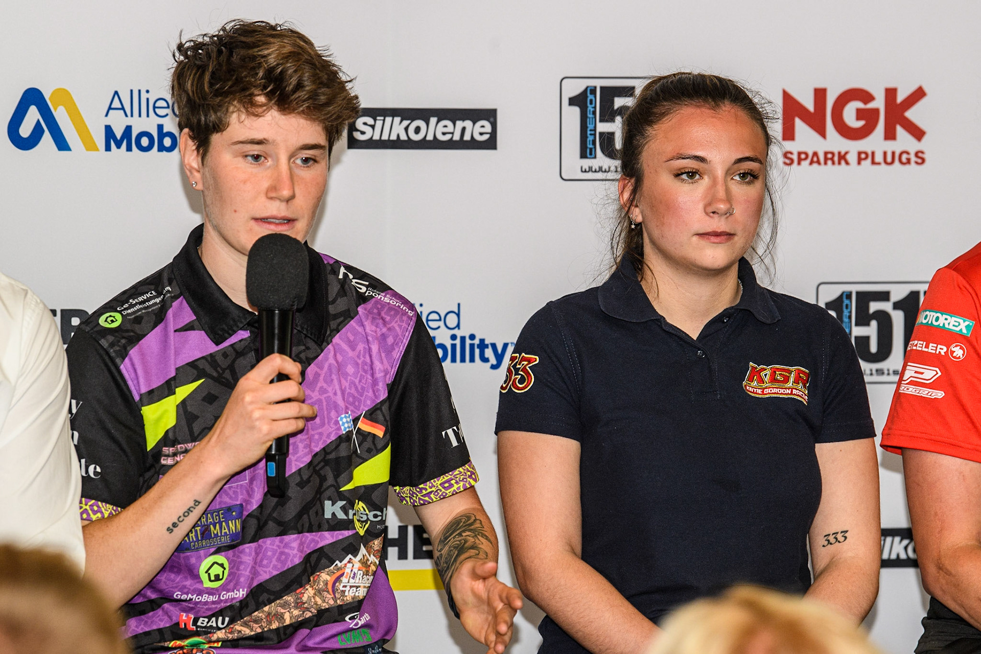 Celina Liebmann (left) answers a question as Katie Gordon listens during the FIM Flat Track World Championship &amp; FIM Women's Speedway Academy Launch at the National Speedway Stadium, Manchester on Monday 3rd July 2023. (Photo: Ian Charles | MI News)