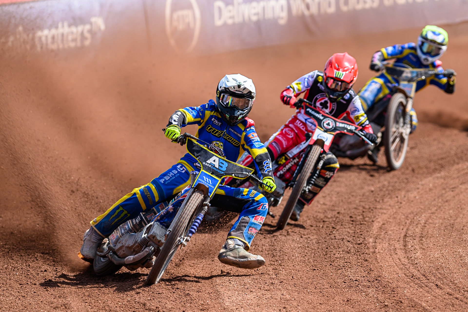 Jack Holder of Sheffield Tigers in White leading Dan Bewley of Belle Vue Aces  in Red and Leon Flint of Sheffield Tigers  in Yellow during the Rowe Motor Oil Premiership match between Belle Vue Aces and Sheffield Tigers at the National Speedway Stadium, Manchester on Monday 25th August 2025. (Photo: Ian Charles | MI News)