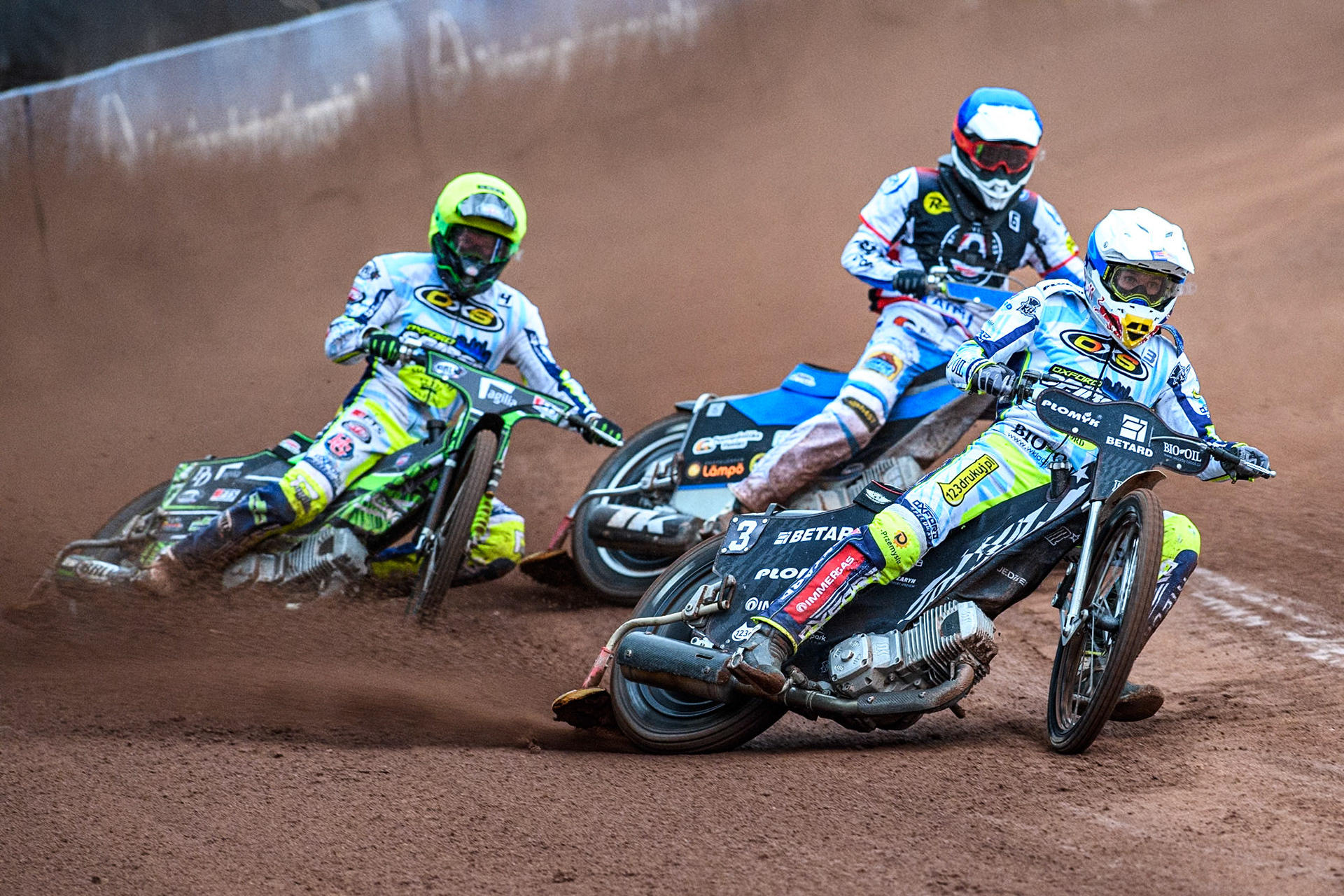 Oxford Spires' Maciej Janowski  in White leading Belle Vue Aces' guest Antti Vuolas  in Blue and Oxford Spires' Charles Wright  in Yellow during the Rowe Motor Oil Premiership match between Belle Vue Aces and Oxford Spires at the National Speedway Stadium, Manchester on Monday 22nd July 2024. (Photo: Ian Charles | MI News)