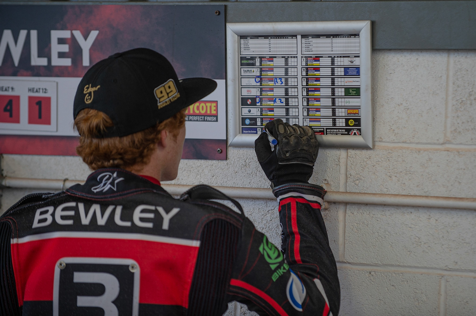 Photo by Ian Charles

Dan Bewley marks his programme

Belle Vue Aces v Poole Pirates, British Speedway Premiership, Belle Vue National Speedway Stadium, Manchester, Monday 1  July  2019
