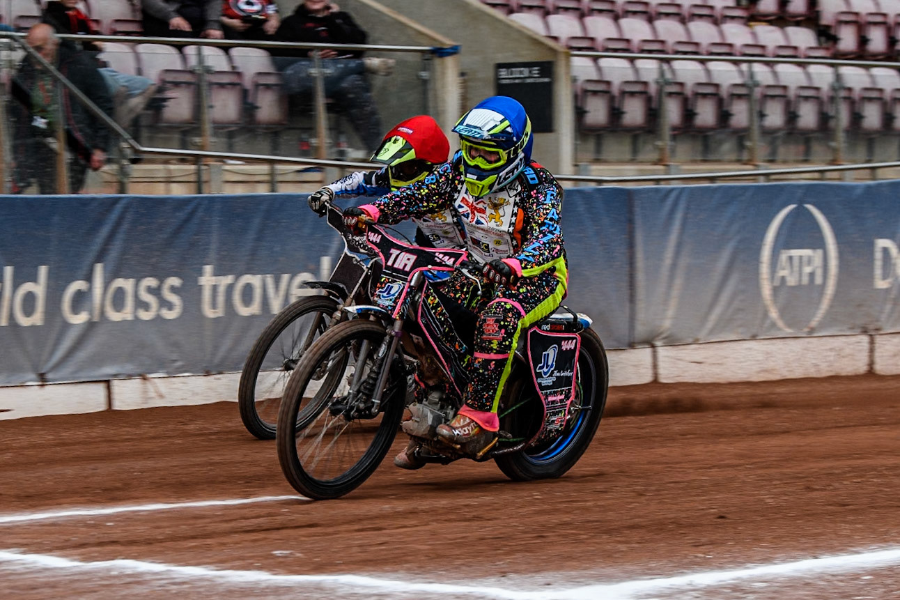 Tia May Brant (125cc) in Blue beats Jack Scully-Syer (125cc)  in Red to the finish line during the British Youth 500cc Championships at the National Speedway Stadium, Manchester on Friday 2nd August 2024. (Photo: Ian Charles | MI News)