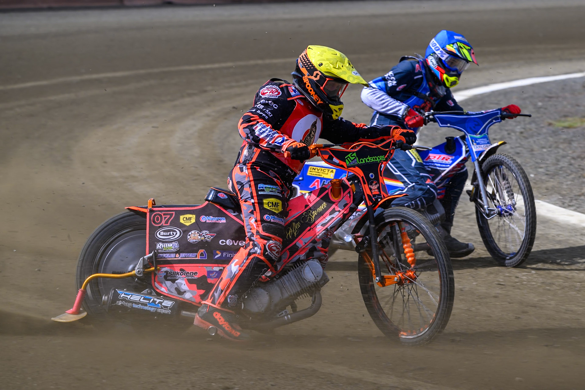 Alex Spooner of NDL Nomads   in Yellow rides outside Jamie Etherington of Buxton Bulls  in Blue during the  Challenge match between Buxton Bulls and NDL Nomads at Hi-Edge Speedway, Buxton on Sunday 19th April 2026. (Photo: Ian Charles | MI News)