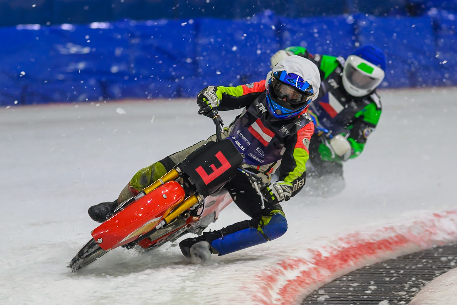 Harald Simon (3) of Austria   in White leading Andrej Diviš (8) of Czechia in Blue during the FIM Ice Speedway Of Nations at Ice Rink Thialf, Heerenveen on Sunday 12th April 2026. (Photo: Ian Charles | MI News)