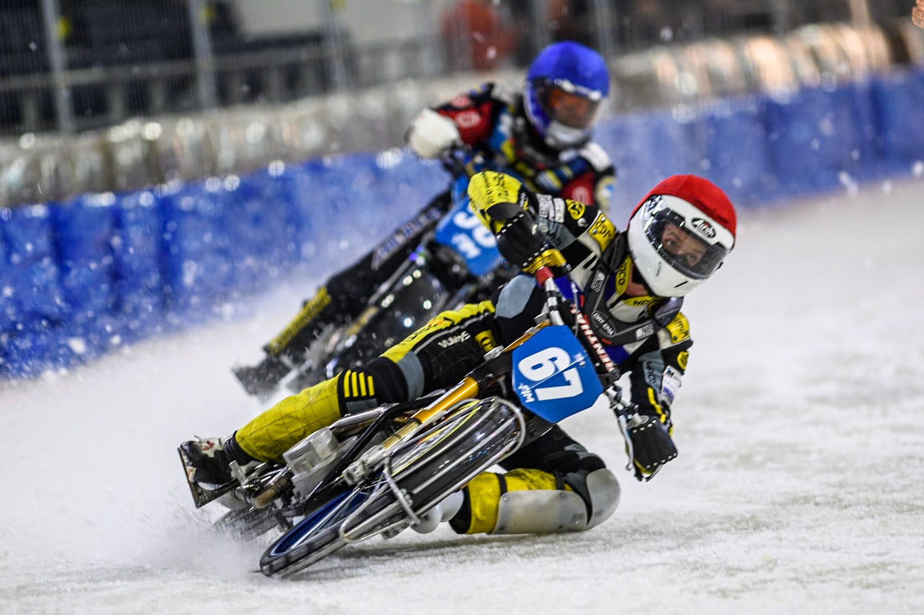 Finland's Heikki Huusko (67) in Red leading Sweden's Stefan Svensson (58) in Blue during the FIM Ice Speedway Gladiators World Championship Final 4 at Ice Rink Thialf, Heerenveen on Sunday 7th April 2024. (Photo: Ian Charles | MI News)