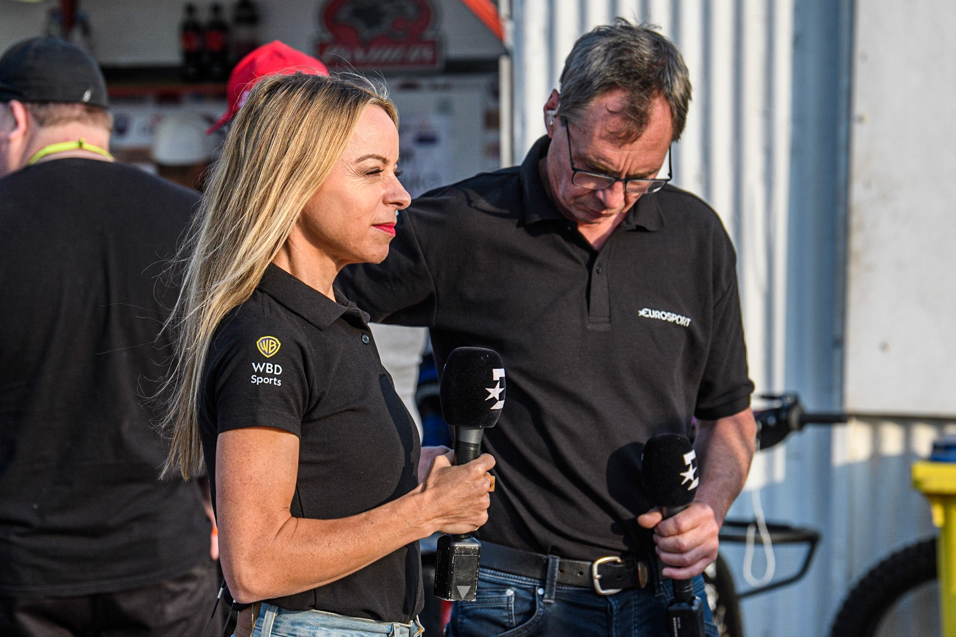 Abi Stepens (left) and Kelvin Tatum prepare to start the Eurosport presentation during the Sports Insure Premiership match between Peterborough and Belle Vue Aces at East of England Showground, Peterborough on Monday 26th June 2023. (Photo: Ian Charles | MI News)