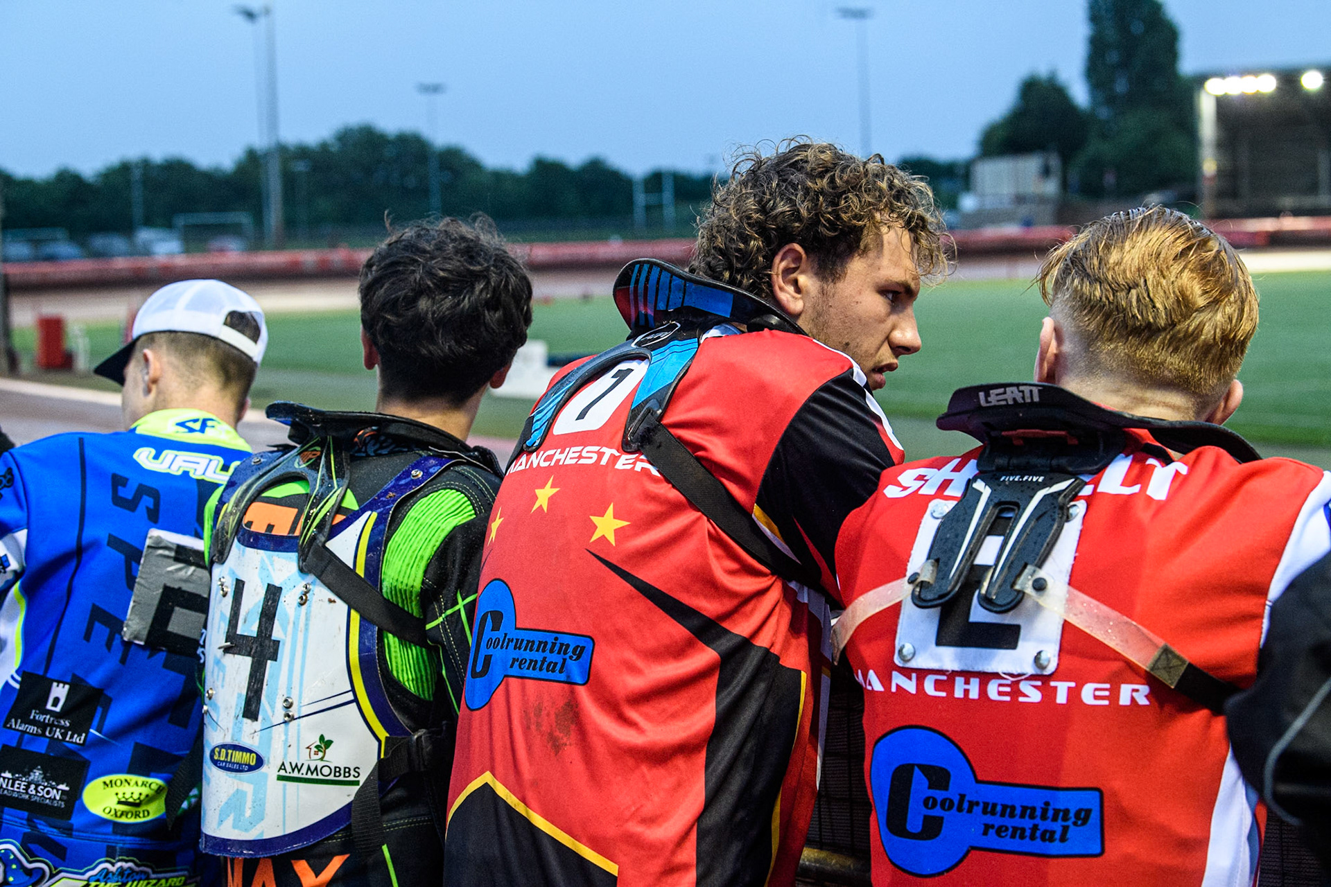 Riders watch the track work : (L to R) Oxford Chargers' Jody Scott , Oxford Chargers' Max Perry , Belle Vue Colts' Harry McGurk , Belle Vue Colts' Jack Shimelt  during the WSRA National Development League match between Belle Vue Colts and Oxford Chargers at the National Speedway Stadium, Manchester on Friday 2nd August 2024. (Photo: Ian Charles | MI News)