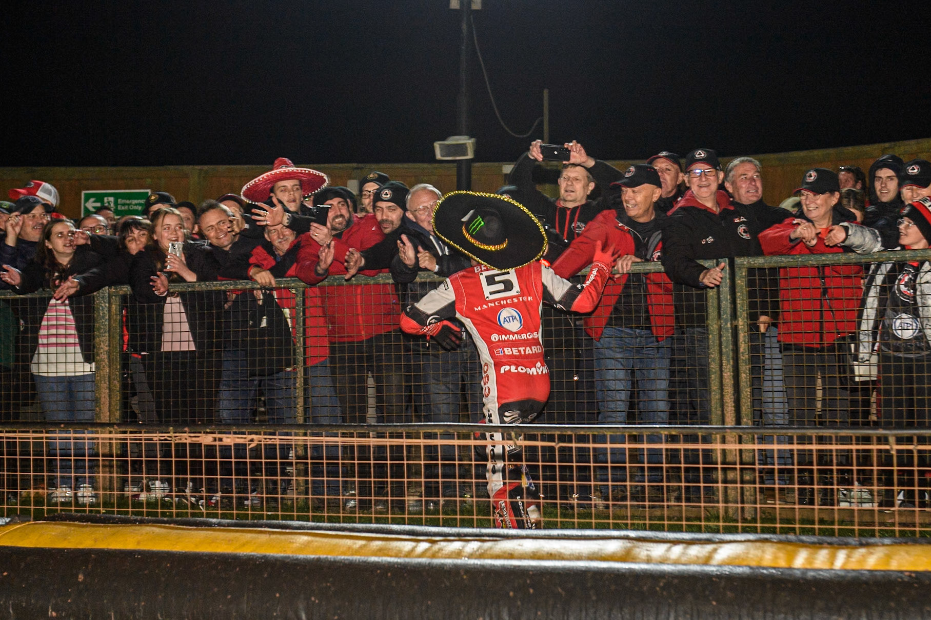 Dan Bewley runs along the fans in celebration during the Rowe Motor Oil Premiership Grand Final 2nd Leg between Leicester Lions and Belle Vue Aces at the Pidcock Motorcycles Arena, Leicester on Thursday 26th September 2024. (Photo: Ian Charles | MI News)